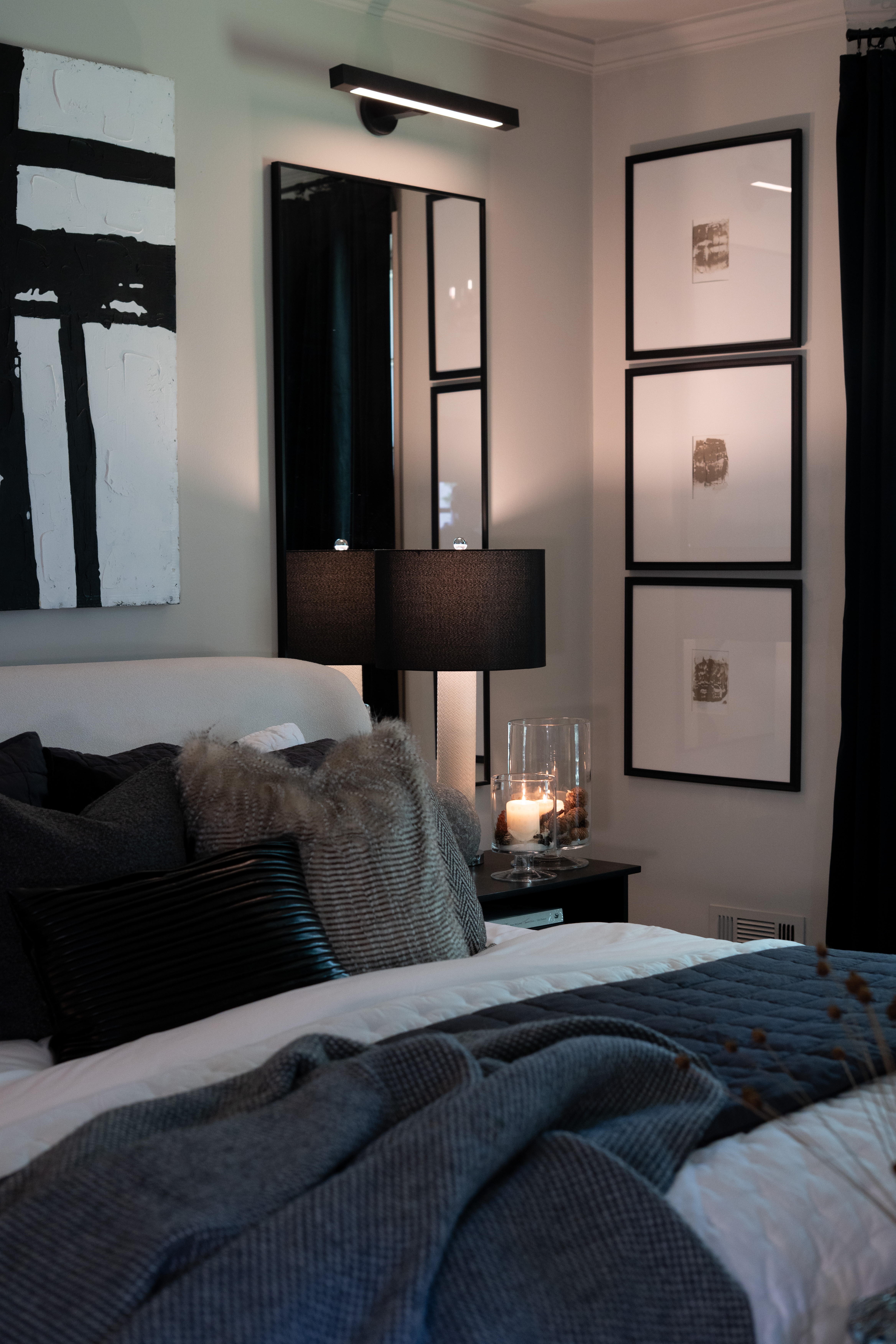 There’s just something about a moody bedroom that feels like pure luxury. The dark accents, layered textures, and soft candlelight make this space so inviting—like the perfect mix of cozy and chic. I love how the modern art ties everything together while still keeping it warm and livable. Honestly, I could curl up here all night and never leave 🖤 

 #LTKFallSale #LTKSeasonal #LTKHome