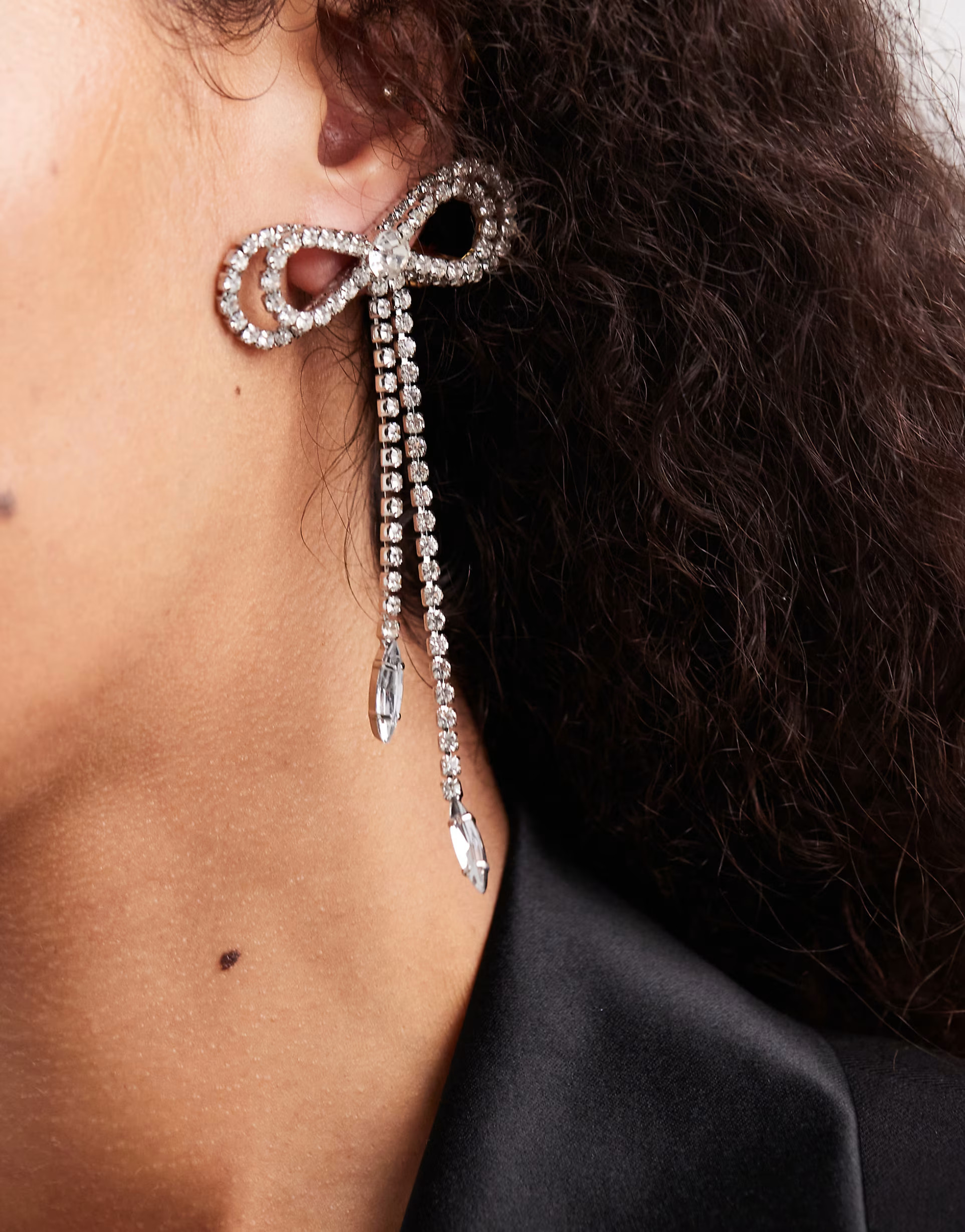 ASOS DESIGN stud earrings with diamante bow design in silver tone | ASOS | ASOS (Global)