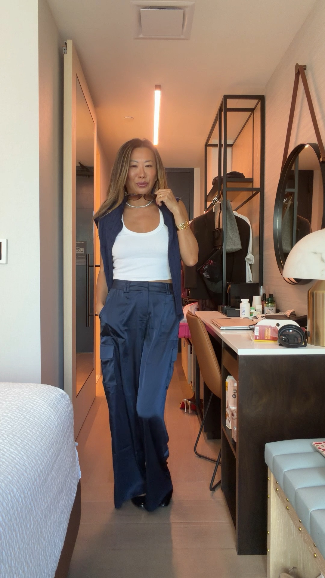 Satin navy cargo pants, white tank, crew neck Amazon cable sweater, Amazon diamond CZ necklace, Amazon sunglasses. Size small on clothing  

#LTKFindsUnder100 #LTKStyleTip