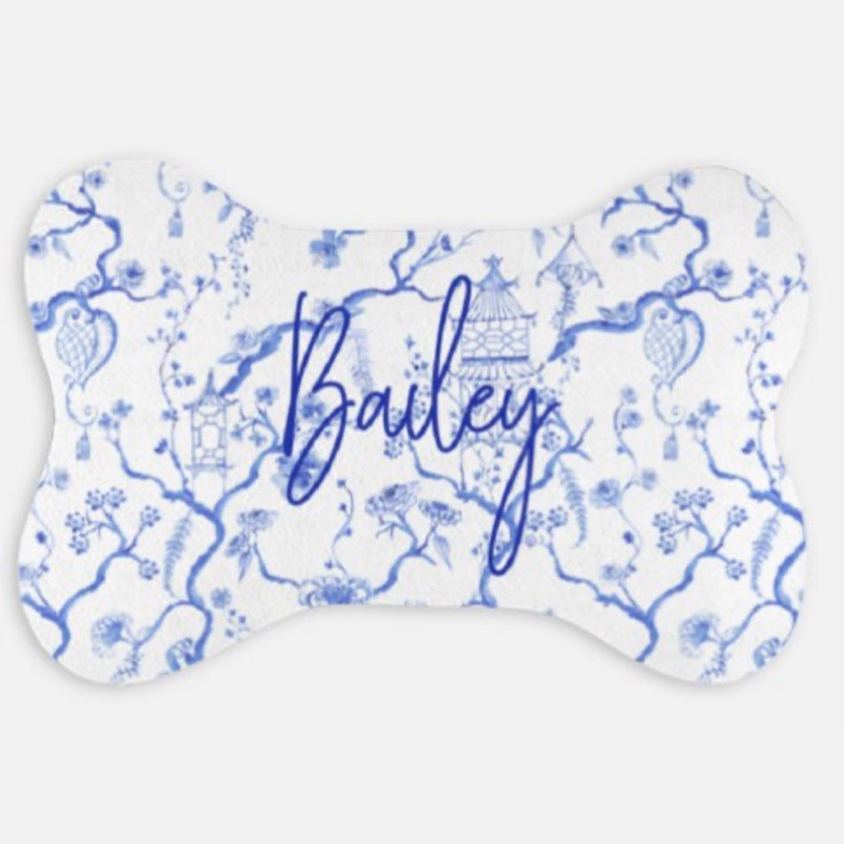 Personalized chinoiserie dog bone shaped dog placemat. Adorable spot for a pair of blue and white dog bowls! 
Comes in blue and white and green and white plus and few other options. With or without name. 

#LTKhome #LTKHoliday #LTKSeasonal