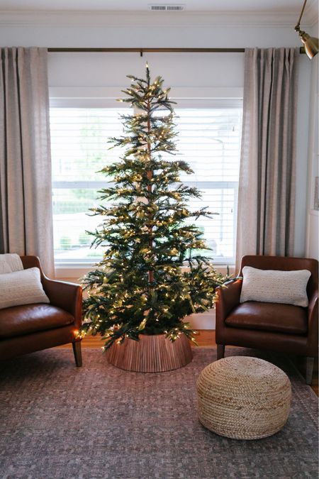 Christmas tree, Christmas decor, Pottery Barn leather chairs, Loloi x Angela Rose area rug, Loloi pillows, Pottery Barn drapes 

#LTKCyberweek #LTKhome #LTKHoliday