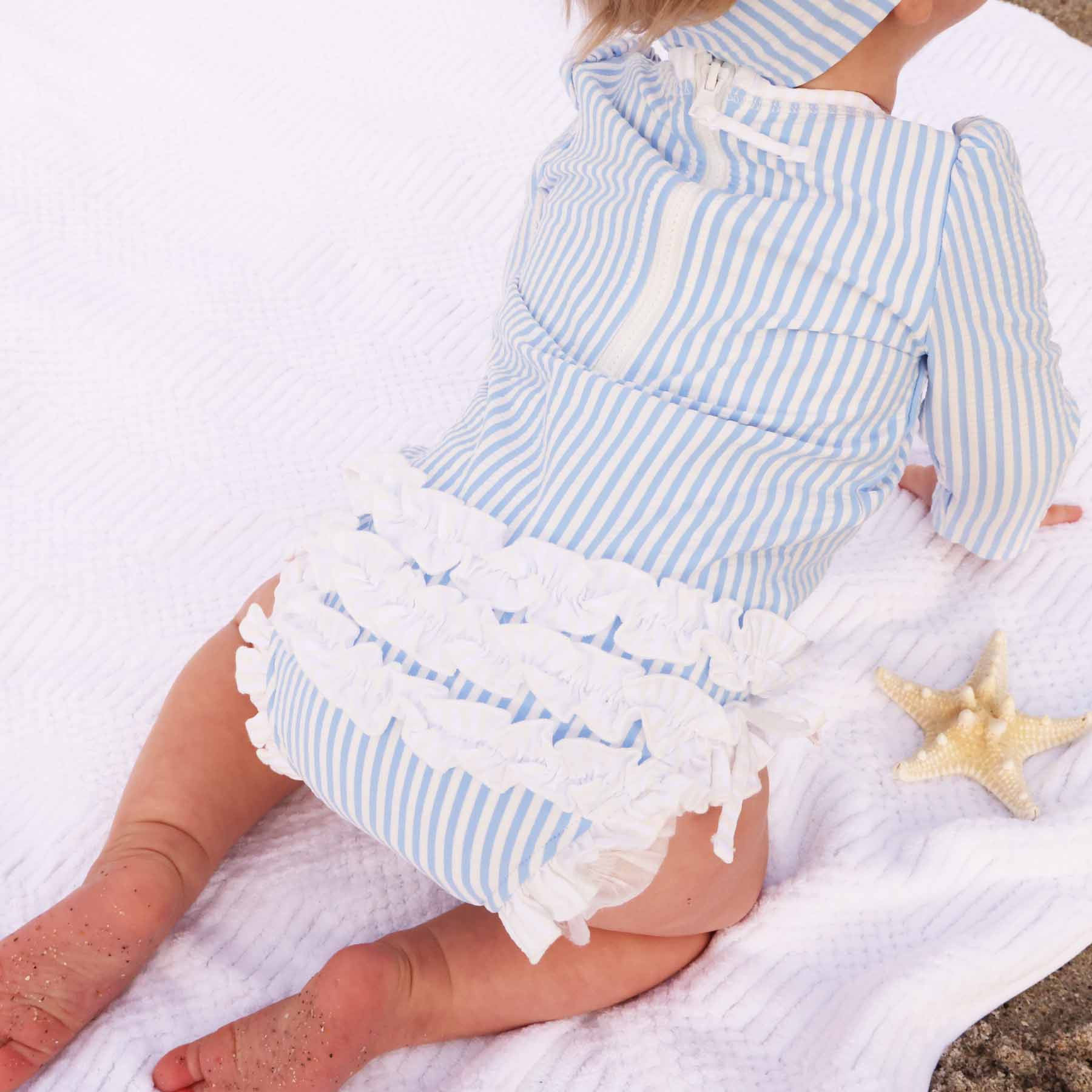 Long Sleeve Rash Guard With Ruffle Bottom | Seersucker Blue | Caden Lane
