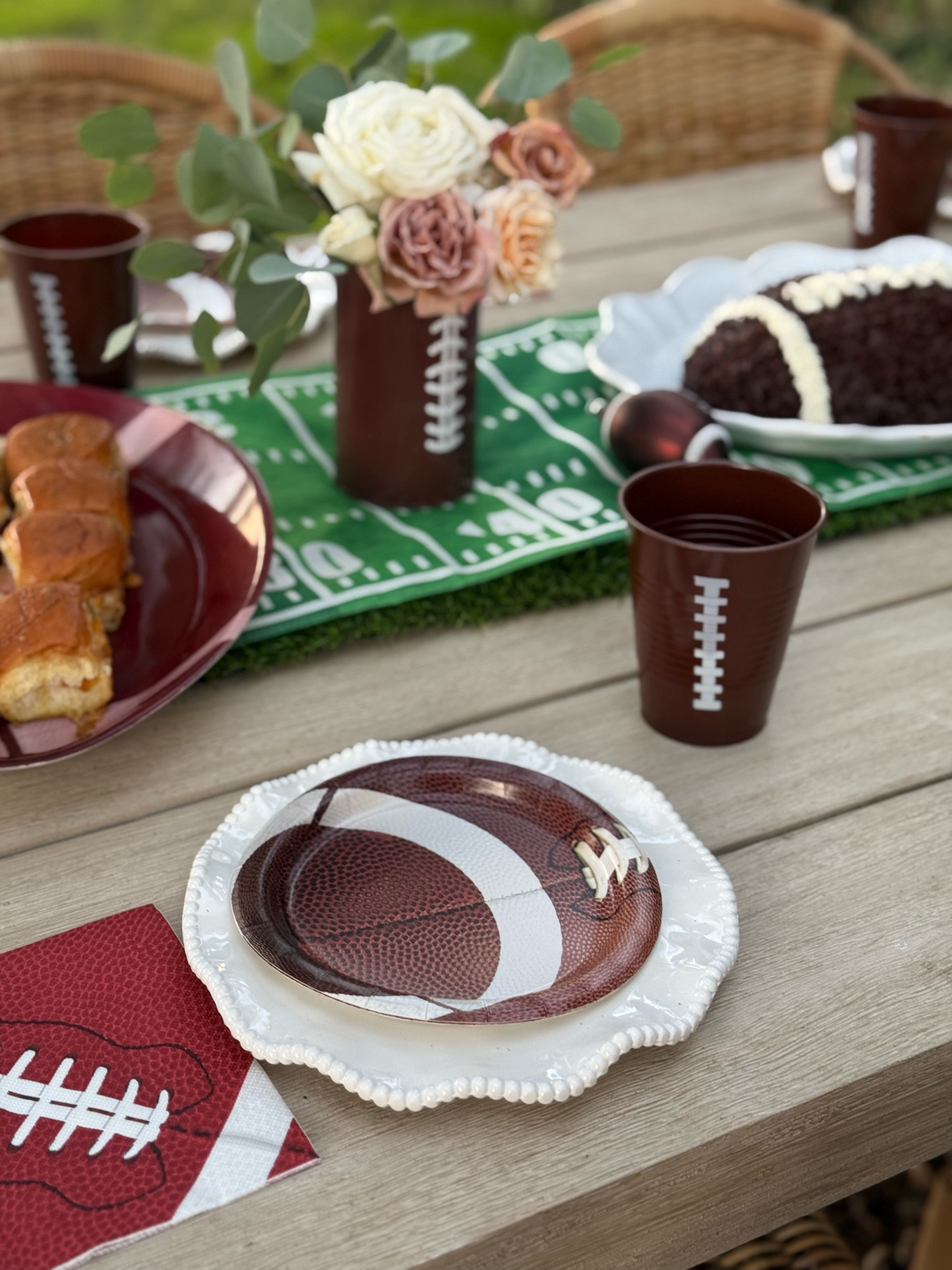 Super Bowl finds. Football paper plates. Football cups. Football table runner. Touchdown table runner. Football platter for appetizers. Football napkins. Metal football vase for flowers makes a great centerpiece. 🏈❤️ 

#LTKParties #LTKSeasonal #LTKHome