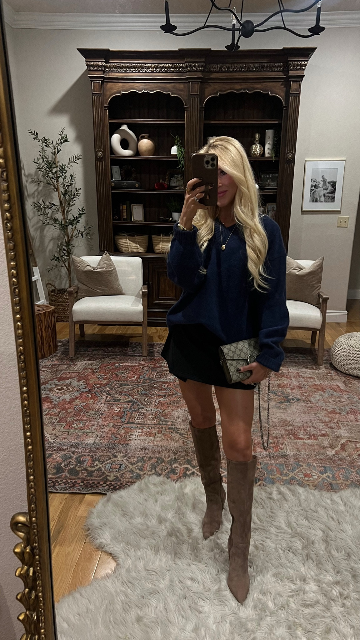 Fall date night outfit💙 mini skirt with boots and a sweater is my goto outfit combo lately- wearing size xs in sweater and skirt. Boots run tts | suede tall taupe boots | daily drills navy oversized sweater 

#LTKStyleTip #LTKPetite #LTKShoeCrush