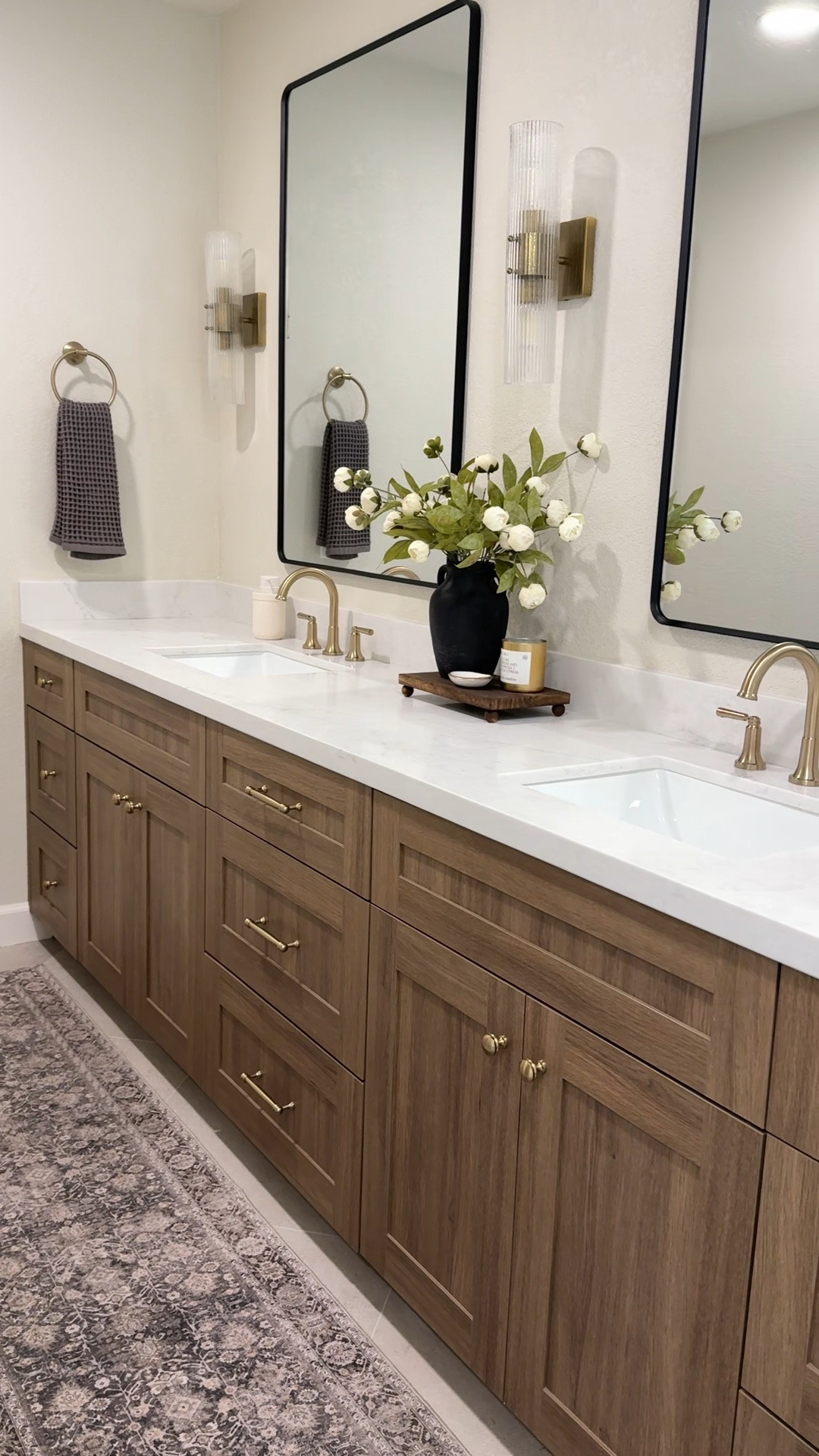 Master bathroom styling inspo! Our primary bathroom brings me so much joy. It’s calming and organized which is the perfect environment for starting your day  
•••
Bathroom decor, master bathroom decor, primary bathroom decor, bathroom counter styling, bathroom runner, runner rug, bathroom rug, bathroom stool, bathtub stool, bath salt jar, bathroom sconces, champagne bronze, delta champagne bronze 



#LTKHome #LTKgrwm #LTKselfcare