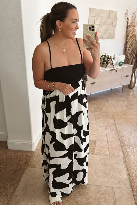 Love this black and white maxi! the straps are adjustable with a back tie. has a back zipper  