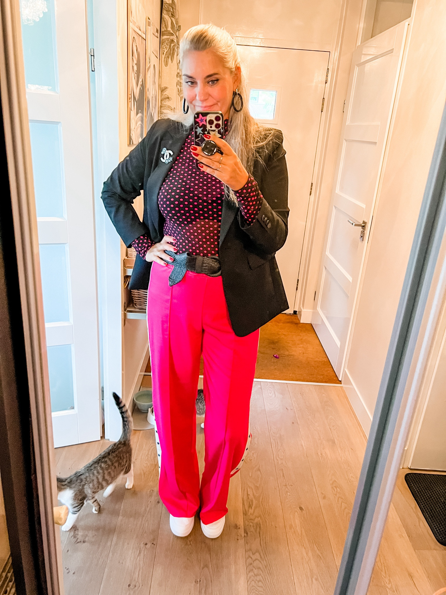 Ootd - Thursday. Hot pink pontiff trousers with stars on the sides (https://most-wanted-nl.mtpc.se/4775333) I wear size L/Tall. Black and pink mesh top (Norah, last year), white and black Puma sneakers, elastic belt, black blazer, pink velvet bow in hair. 

#LTKstyletip #LTKeurope #LTKnederlands