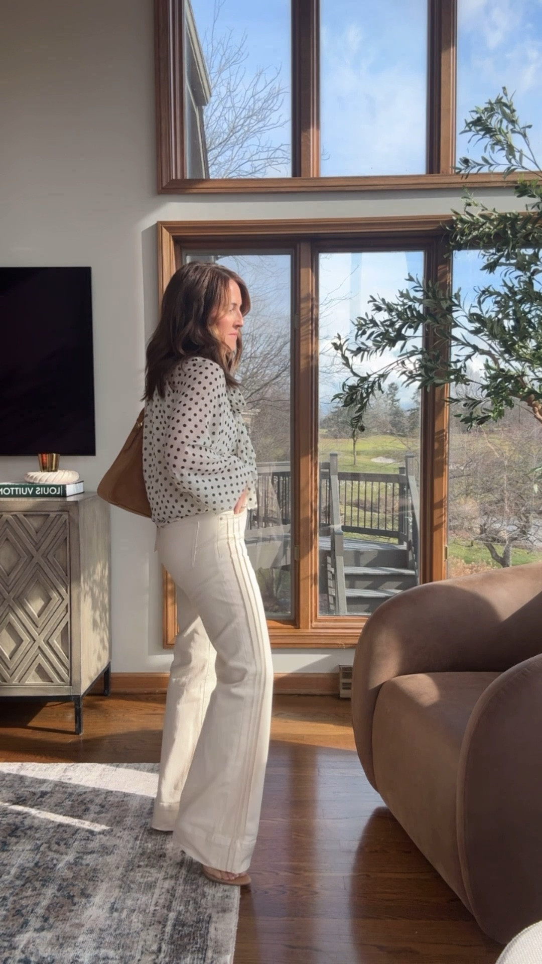 Wide leg ecru jeans. True size 25 here. Might size down one as they are a tad loose at the waist. 
XS polka dot blouse. 
Such a chic combo  

#LTKootd #LTKSeasonal #LTKOver40