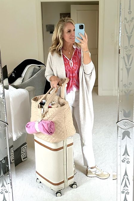 Travel style
Mersea Lightweight but cozy long cardigan sweater 
The most comfortable and flattering white jeans 
Paired with a colorful shirt in French top and my favorite Veronica Beard sneakers 
My holy grail, travel set includes the MZ Wallace deluxe metro tote and the Paravel aviator plus carry-on 
For more packing tips, go to Aliciawoodlifestyle.com and search packing!

#LTKSeasonal #LTKover40 #LTKtravel