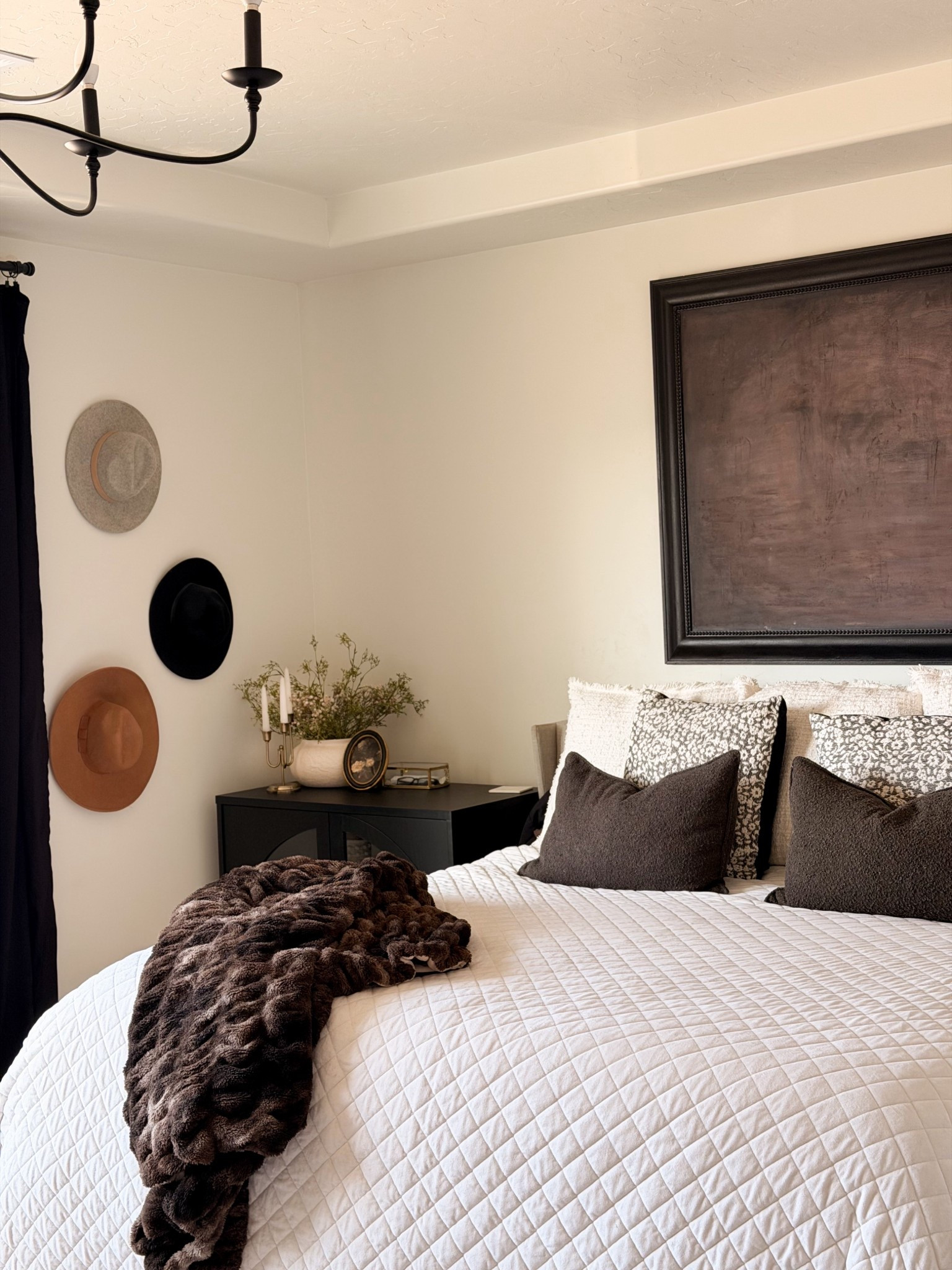 Creating the coziest neutral bedroom with layers that feel warm, elevated, and timeless 🤎 This space is all about soft textures, moody neutrals, and that perfectly collected, lived-in look. The white quilted bedding, dark accent pillows, vintage-inspired wall art, and black chandelier bring in the perfect mix of modern organic and moody vintage style.

I love styling bedrooms with warm browns, creams, blacks, and soft textures for a look that feels calming, intentional, and designer-inspired without being cold or boring. From the cozy throw blanket to the neutral pillows and minimal decor, this is one of those spaces that instantly feels like a retreat.

If you’re decorating a modern neutral bedroom, moody farmhouse, European cottage, or organic modern home, this look is such an easy one to recreate. Everything here is affordable, high-end looking, and perfect for anyone who loves cozy bedroom decor, neutral home styling, and timeless interiors.

Linked everything so you can shop this bedroom look 🤍✨

#LTKhome #LTKbedroom #LTKdecor #neutralbedroom #cozybedroom #modernorganichome #moodyhome #vintageinspired #warmneutralhome #bedroominspo #designerinspired #affordablehomedecor #timelessstyle #layeredhome


#LTKHome #LTKFindsUnder100 #LTKFindsUnder50