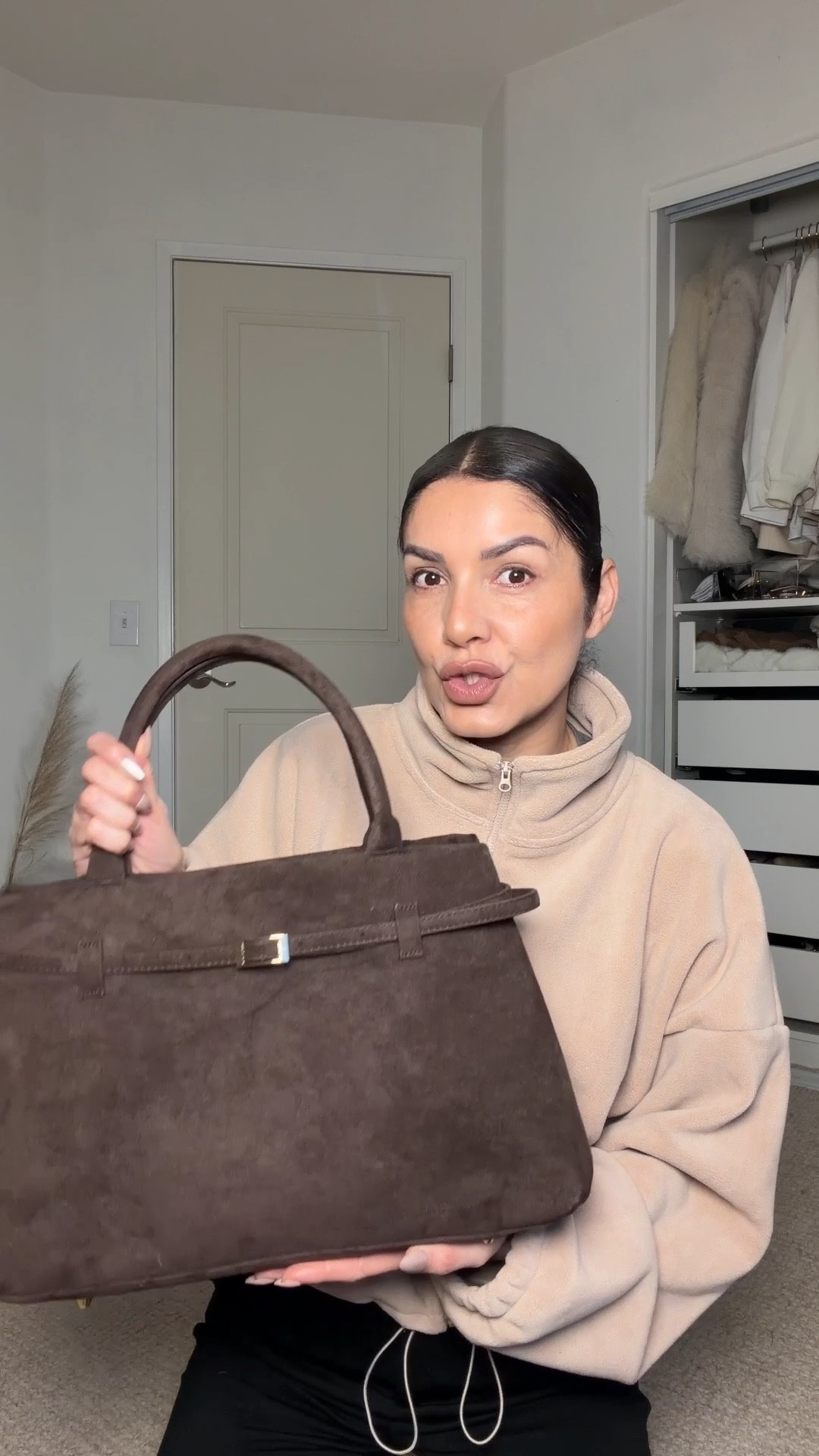 This amazon faux suede bag is designer inspired and has great quality, the bag is cute, luxe   and very roomy that fits my 14 inches laptop. 
Amazon bag
Faux brown chocolate brown suede bag