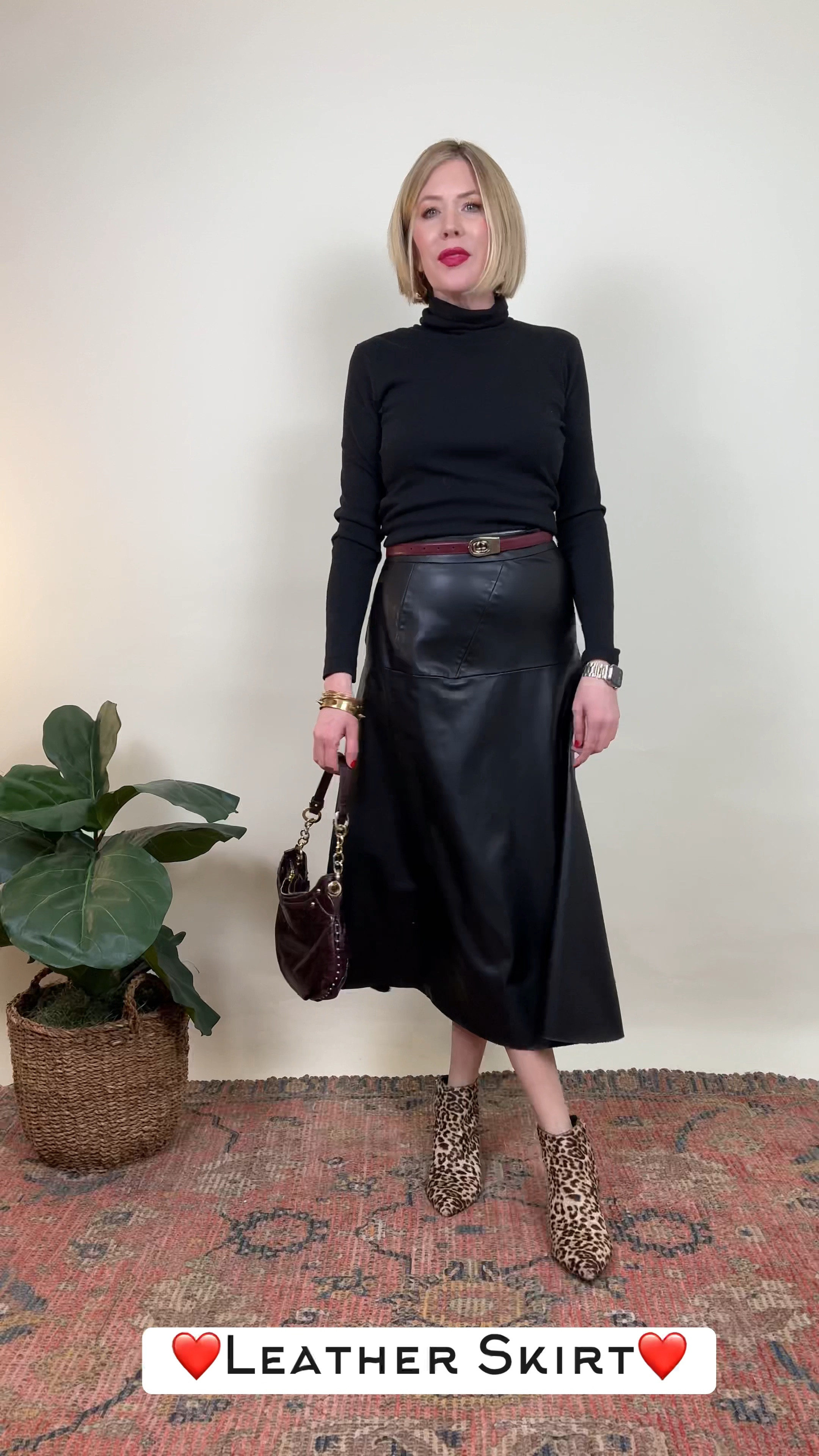 Classic meets trendy ✨ Taking a timeless black leather skirt and a sleek black turtleneck and giving it a modern twist! By adding this season’s must-have accessories—a chic burgundy bag and belt for a pop of color—and finishing it off with a touch of boldness through animal print shoes, this look goes from timeless to totally current. This combination proves that with the right accessories, even the classics can get a fresh, stylish update! How do you elevate your wardrobe staples? 🖤🍂 

#LeatherSkirt #LeopardBoots #ClassicStyle

#LTKStyleTip #LTKOver40 #LTKHoliday