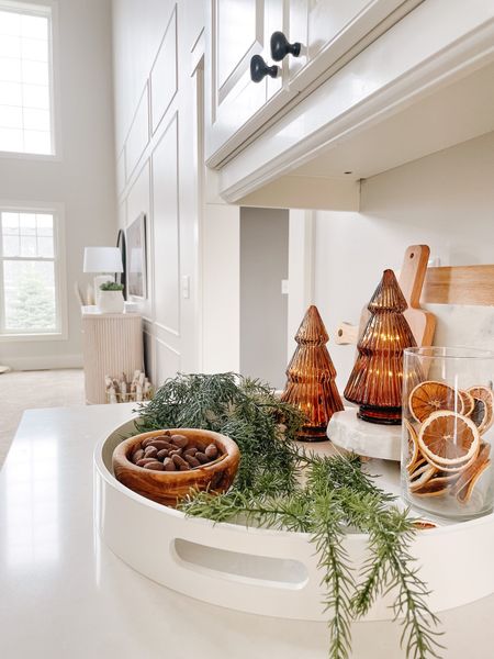 Adding a few touches in my kitchen to create a warm and cozy home this holiday season.

Tip: Amber trees were purchased at the Target Dollar spot

#christmas
#christmasdecor
#traystyling
#beautifulchristmasdecor

white tray, Amber trees, greenery, dried oranges, wood bowls, neutral Christmas 