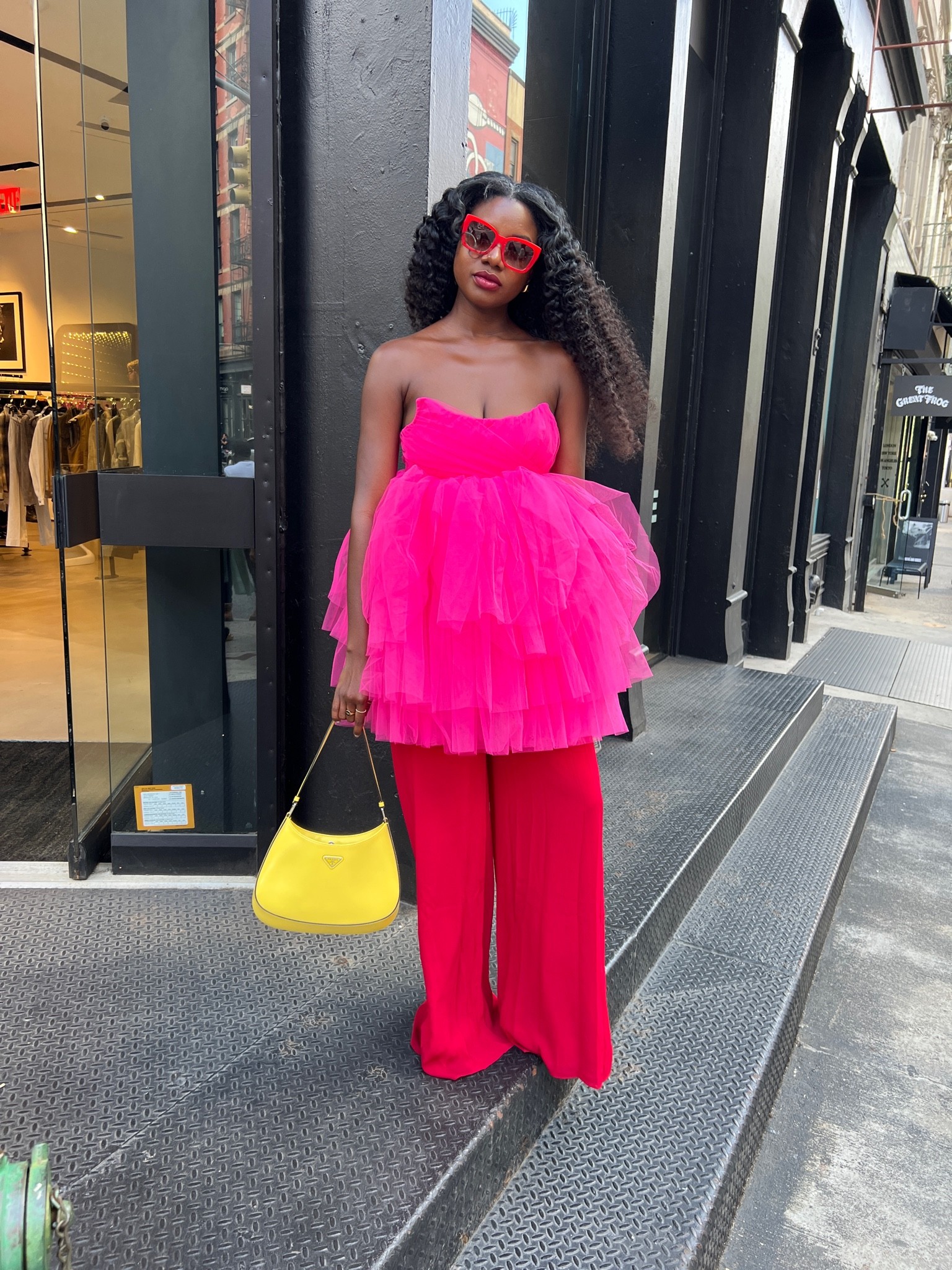 Pink tulle dress with a sweetheart neckline paired with red wide leg pants, yellow Cleo Prada bag and Prada sneakers  

#LTKstyletip #LTKSeasonal #LTKCon