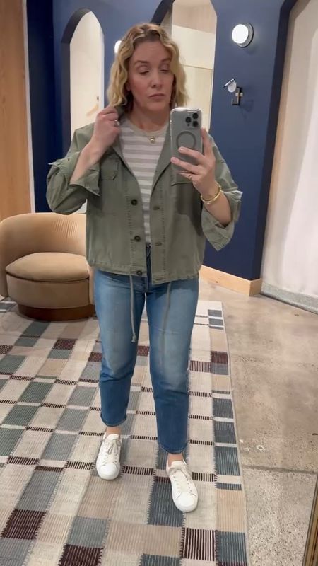 Spring outdoor event look: neutral striped short-sleeve tee, army green utility layering jacket, jeans and sneakers (exact not available but linking super similar) All tts. Allison in a medium on top and a 29 in the jeans. 

#LTKover40 #LTKVideo #LTKstyletip
