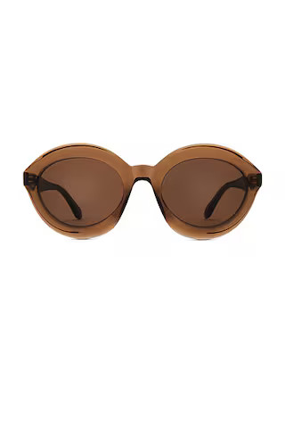 ALAÏA ALAЇA Round Sunglasses in Brown | FWRD | FWRD 