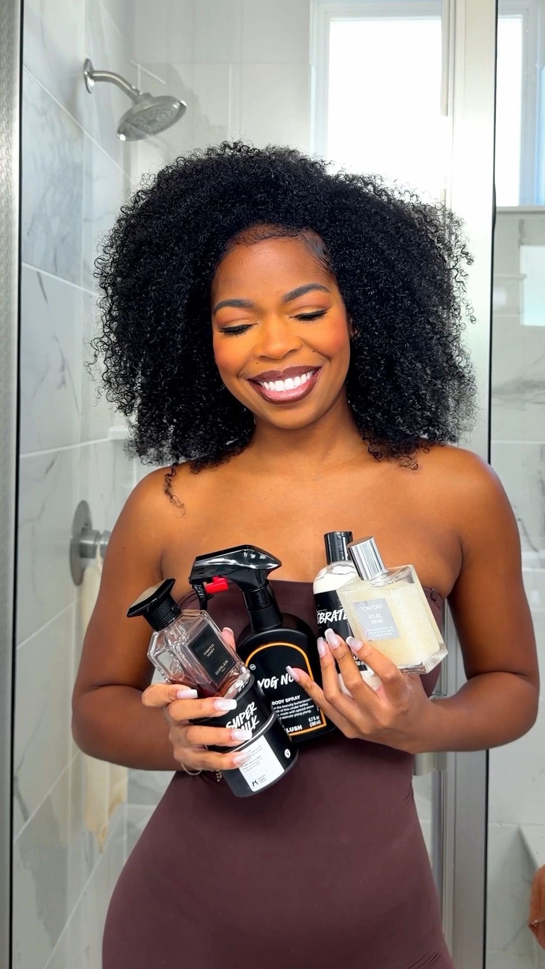 A sweet + clean + smoky fragrance layering combo that eats every time 🤎✨

What’s in your line up, that you love? 
Pro tip: start with Lush, their body sprays seriously last ALL day. And as a consumer, I’ve been DYING to try their dusting powder… I finally got one in PR and now I’m actually obsessed 😭😍

Lush is 50% off rn so I’m definitely about to stock up on the massage oil bars and I want to try their hair spray! 
My exact lineup is linked in my LTK 
1.	Lush Body Lotion or I love the eos body cream in vanilla  (thick + moisturizing base)
	2.	Lush Massage Bar – Turmeric Latte
	3.	Deodorant
	4.	Lush Dusting Powder in “Super Milk” (neck, underarms, inner thighs, underboob)
	5.	Lush Body Spray – Yog Nog (go light ,lasts ALL day)
	6.	Tom Ford – Soleil Neige (clean + glowy)
	7.	Guerlain – Tobacco Honey (rich, warm finish) she’s pricy but so worth it! 
#naturalhair #explore #grwm #fragrance 

#LTKgrwm #LTKfitnessgoals #LTKdayinmylife