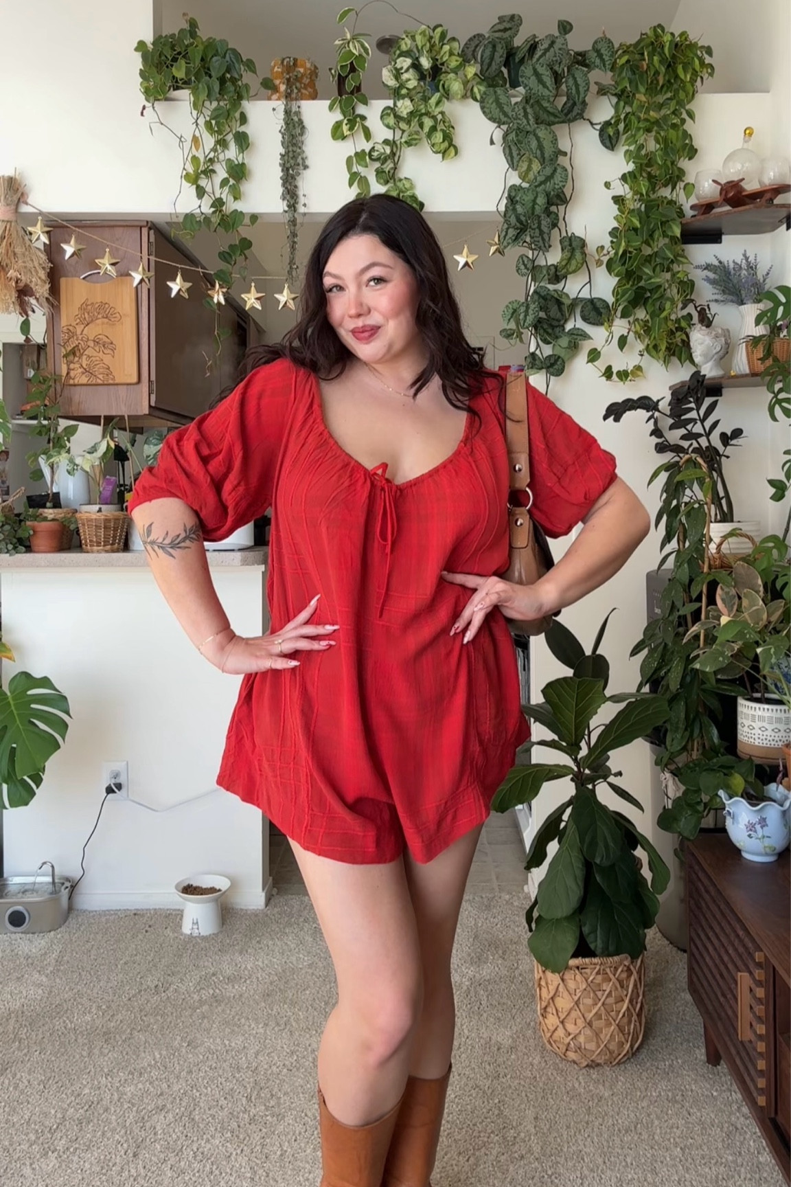 Size L in romper, boots are Frye, bag is coach