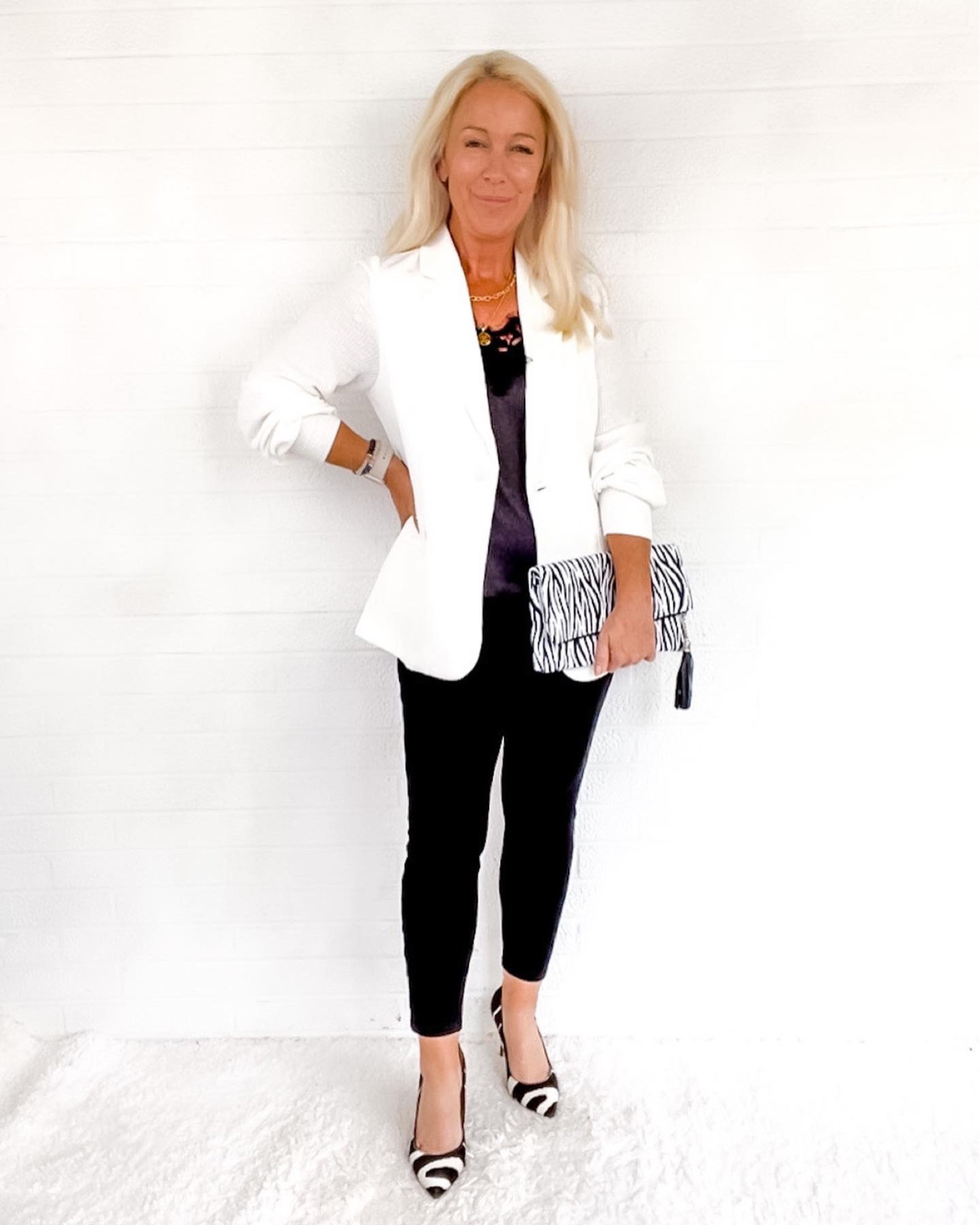 Night Out Looks for Midlife Women. 5’1 4P:
- White blazer with sweater sleeves S
- Black camisole
- Black ankle jeans
- Zebra clutch
- Zebra pumps

#LTKitbag #LTKSeasonal #LTKshoecrush