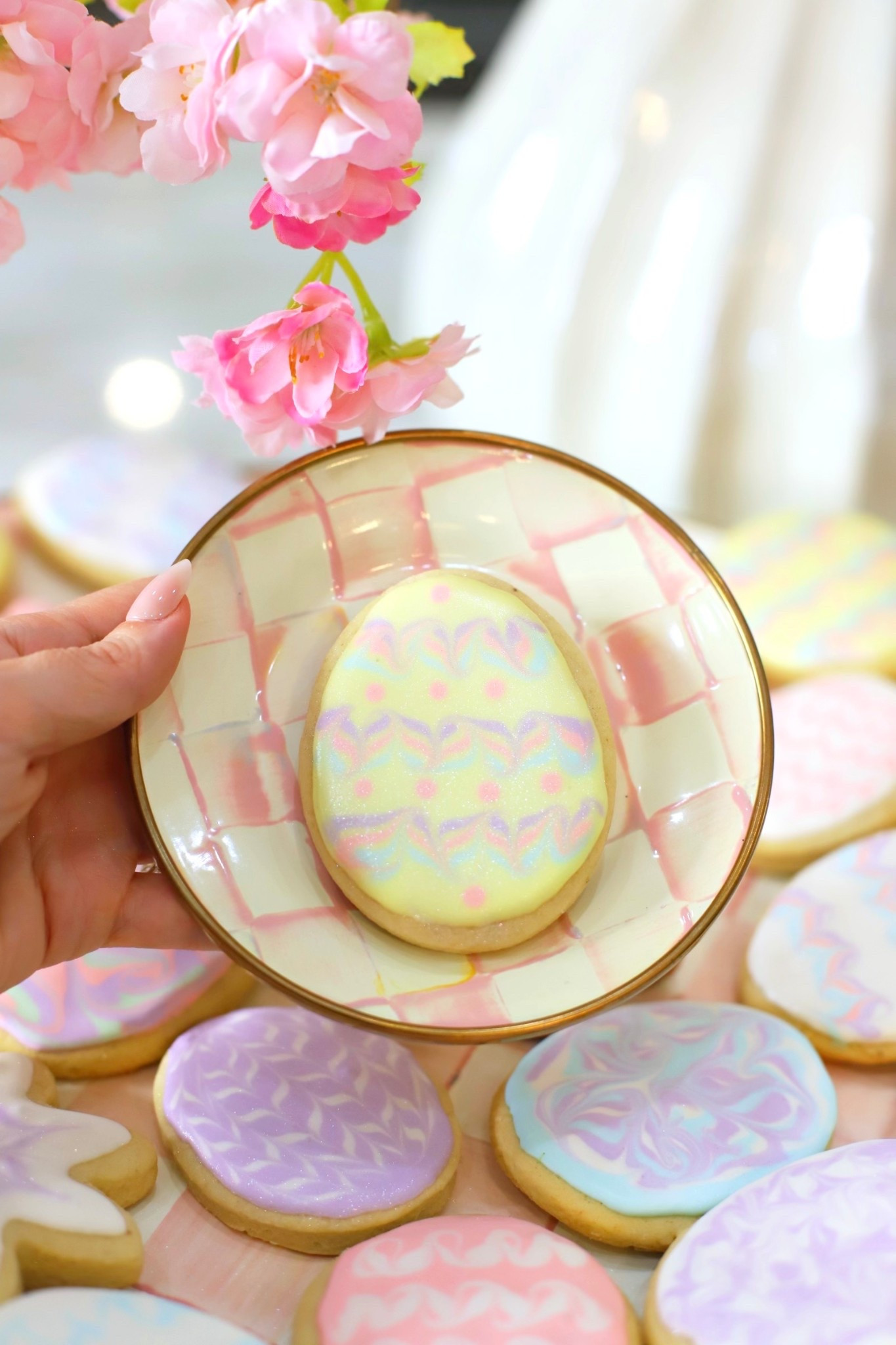Soft, fluffy, and so easy to make! These are my grandma’s famous sugar cookies and these little tips make them turn out perfect every time! Think soft, almost cake like cookies with the prettiest royal icing. Perfect for Easter!

And if you love a pretty kitchen moment as much as I do, all the utensils I used are @mackenziechilds Rosy Check! 

ICING RECIPE:

Beat:
3 TBSP Meringue Powder
1/2 + cup Warm Water (Until frothy)

Add:
4 Cups Powdered Sugar
(Slowly until glossy)

Add:
Vanilla to taste and more water if the icing is too stiff. This dries pretty fast (within 5-10 minutes)

GRANDMA’S SOFT SUGAR COOKIE RECIPE:

1 Cup Soft Butter
11/2 Cups Sugar
2 Eggs
1 Cup Sour Cream
11/2 TSP Vanilla
41/2 Cups Flour
1 TSP Salt
1 TSP Baking Soda
1/2 TSP Nutmeg

Cream butter and sugar till fluffy, add eggs and beat well.
Add sour cream and vanilla, blend well. Add dry ingredients. The dough will get quite soft. Chill for several hours or over night is best. Roll to 1/4 inch thickness, cut, (sprinkle with sugar if you don’t plan to frost), and bake at 375 for 8-12 minutes just until some edges get barely golden). Undercooked is better than overcooked. 

#LTKHome #LTKfoodie #LTKSeasonal