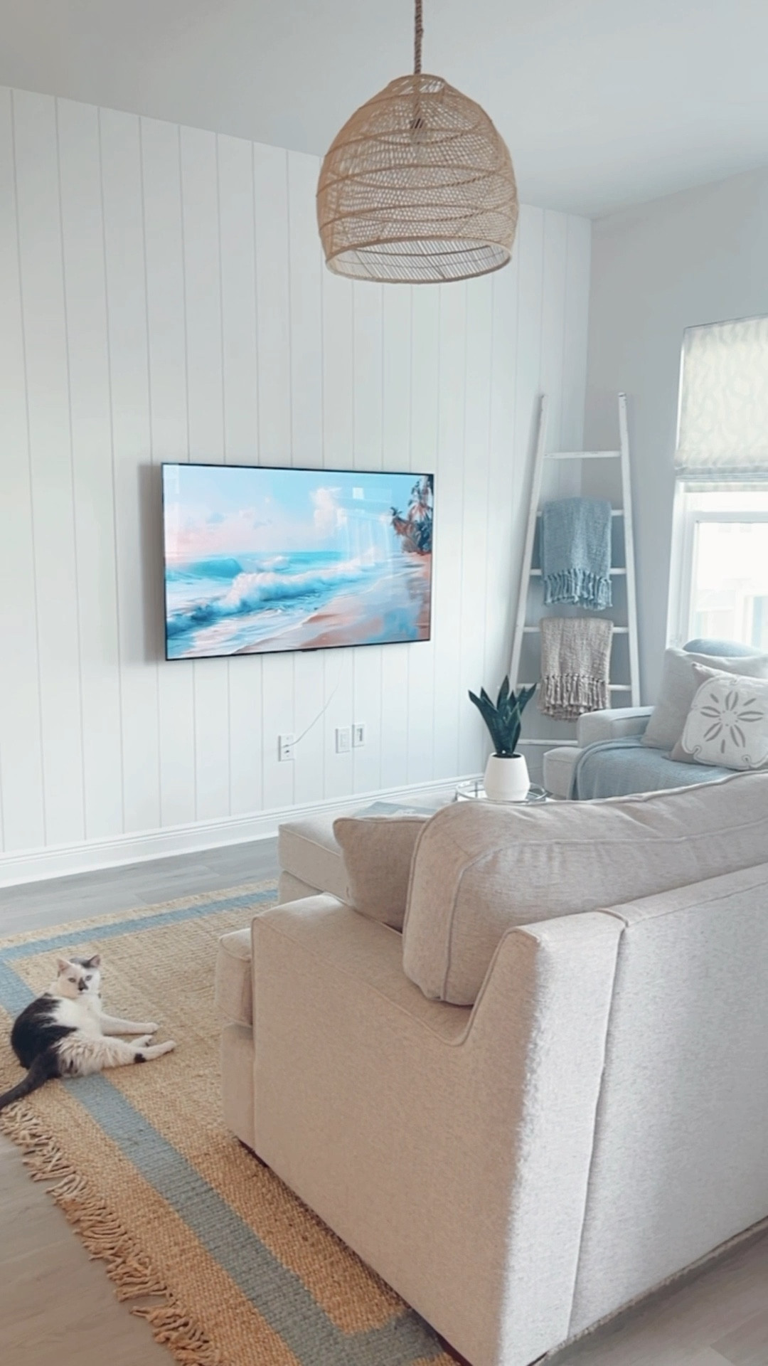 Modern Coastal Living Room on SALE!!! 

We added new home decor, furniture, + lighting to our living room in our Florida home. With living so close to the beach, we wanted it to have modern coastal decor.

We designed it so the space has a light + airy feeling.

Our neutral living room has pops of blue, so the jute rug with a blue border fit the space perfectly. Our sectional couch is a neutral color, so we added blue throw pillows and blue throw blankets. The palm leaf and sea shell accent pillows also added a coastal touch to the couch.
We love the blanket basket for our living room, but we use it for storage in our bedroom too.

The oversized glass vase with tall palm leafs added to the beach decor and helped also add some color against the white shiplap wall. This greenery matched the faux snake plant on our end table.

Our end table matched the jute rug and helped add some texture to the space. Its sandy color bring warm beach tones to the space.

The rattan light pendant brightens the room while giving it a beachy feel! 

#LTKSeasonal #LTKSaleAlert #LTKHome