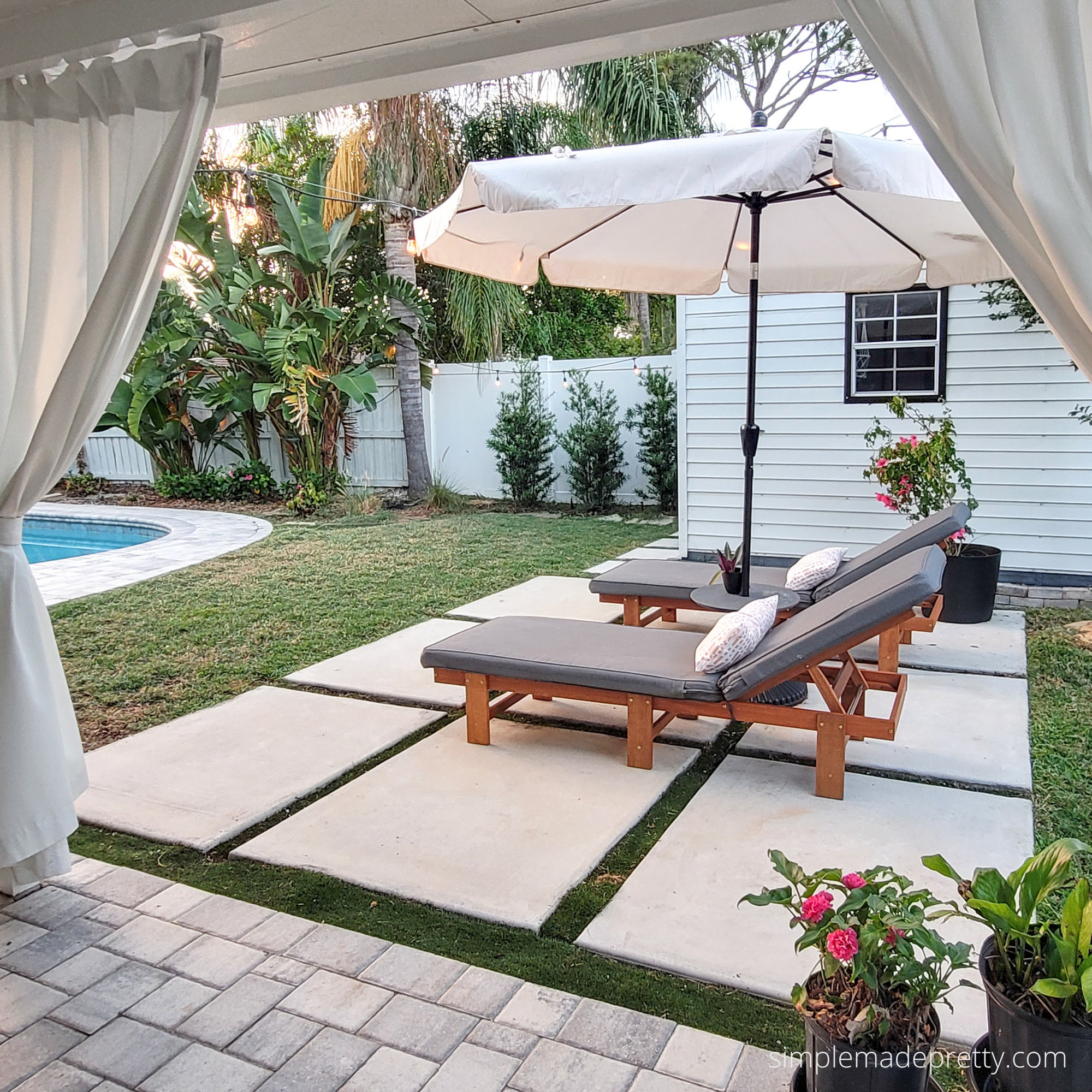 My favorite spot in the backyard 🌴☀️

We turned this little corner into a resort-style lounge area with outdoor curtains, oversized pavers, comfy loungers, and a big umbrella for shade. It's become my morning coffee spot, afternoon reading spot, and favorite place to unwind at the end of the day.

I've linked everything I could find (or similar pieces) in my LTK if you're planning a backyard refresh this season.

Would you rather spend your summer by the pool or on the patio? ⬇️

#BackyardMakeover
#BackyardInspiration
#OutdoorLiving
#PatioDecor
#PoolsideLiving
#OutdoorSpaces
#BackyardGoals
#OutdoorDecor
#FloridaLiving
#PatioStyle
#LTKHome
#SummerDecor 

 #LTKHome #LTKSwim