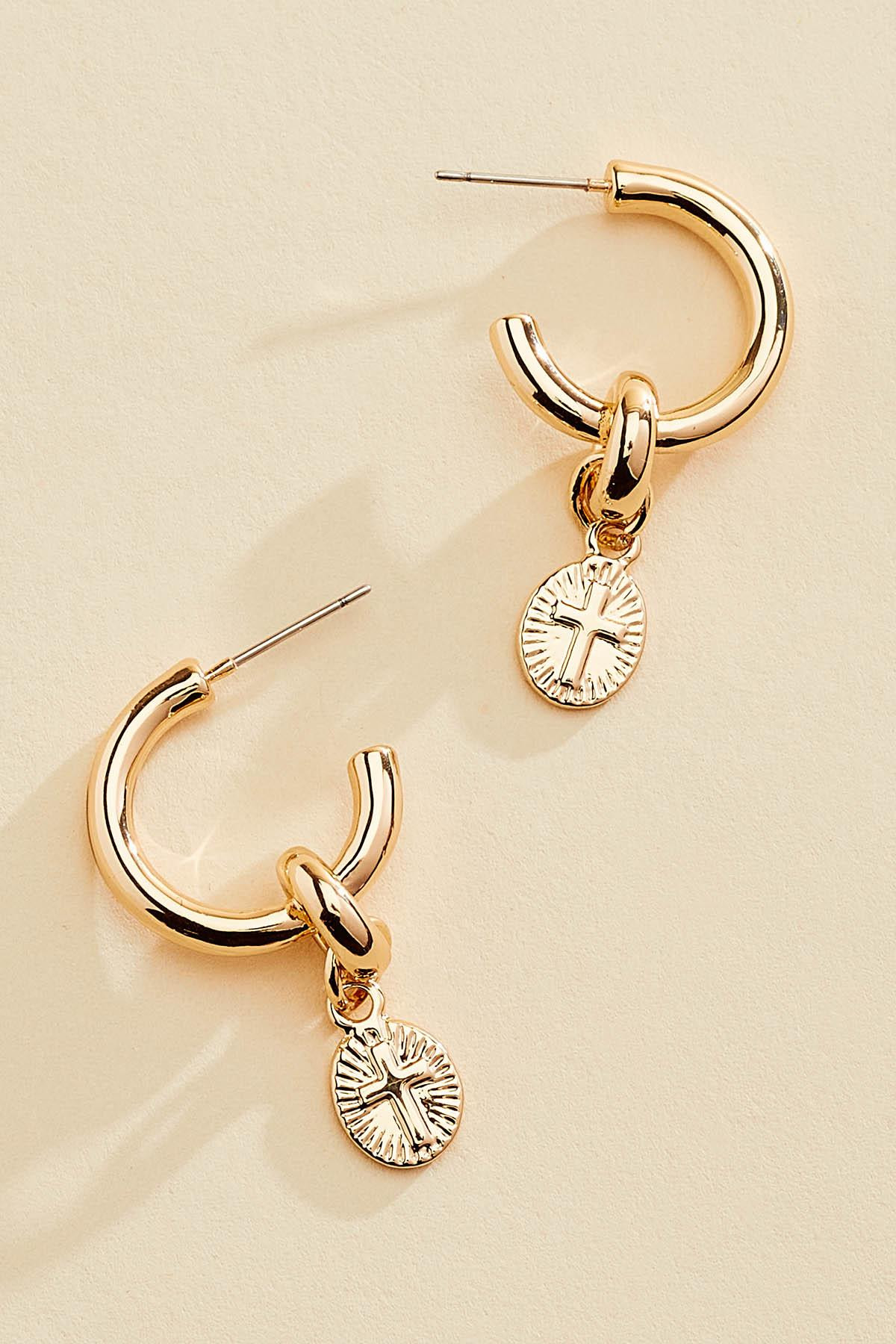 cross charm huggie hoop earrings | Versona