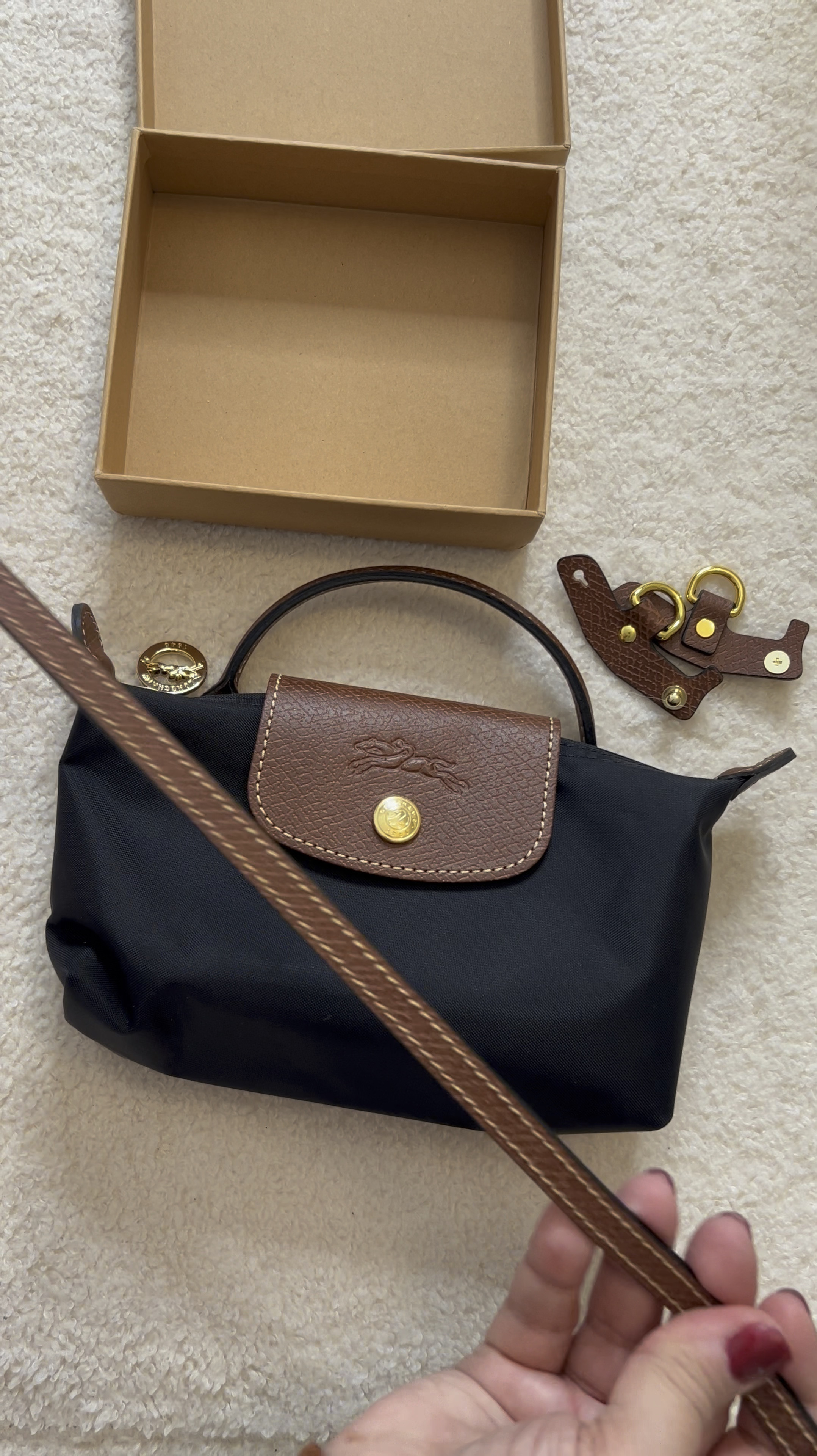 Grab a strap kit to attach to your Longchamp pouch with top handle to create a crossbody bag! 

#ltkcanada #ltkautumn

#LTKStyleTip #LTKItBag #LTKSeasonal