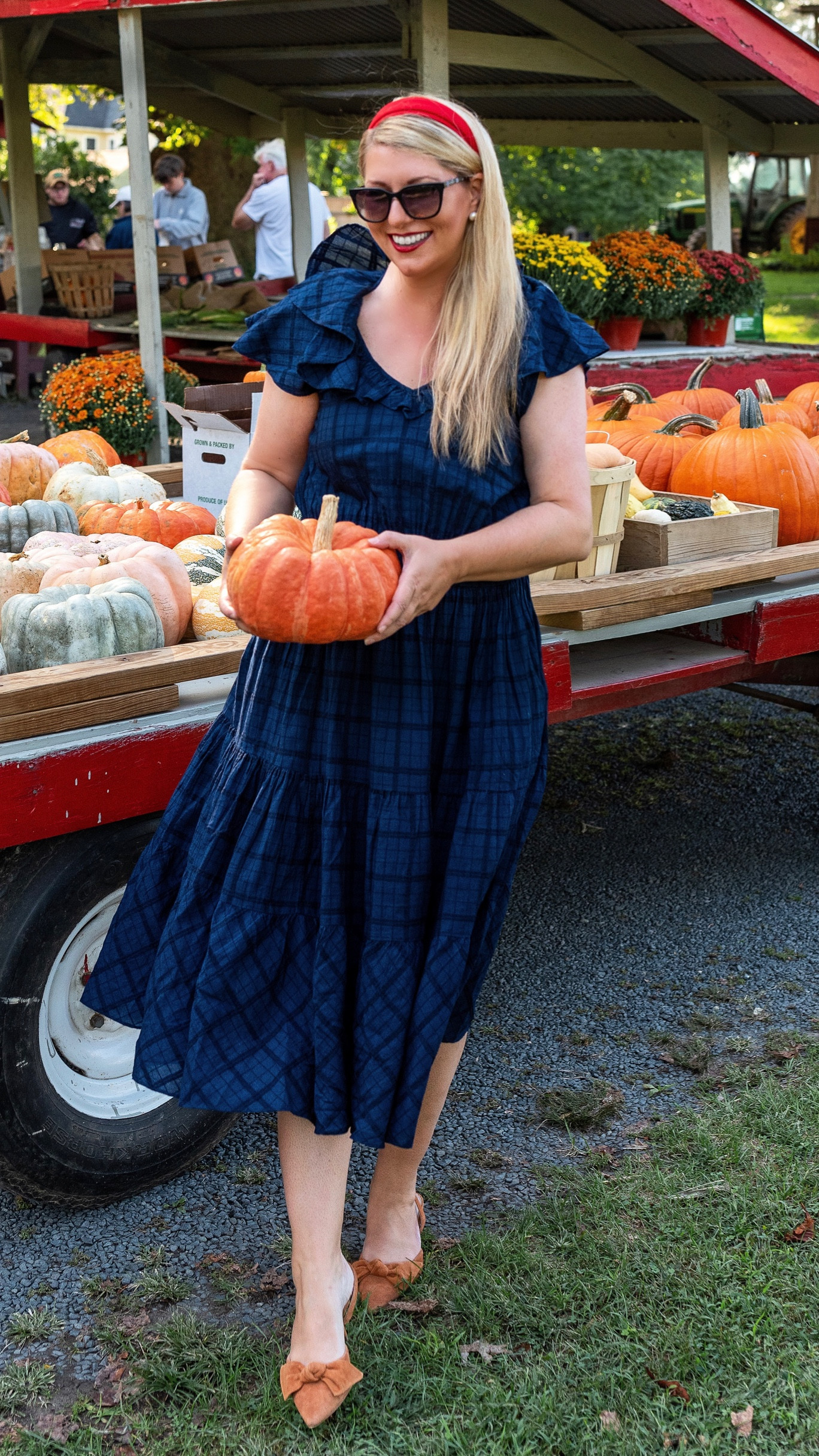 On sale! 25% off at Draper James! A beautiful blue plaid midi dress for fall. Linking fall outfit details including suede bow heels, red headband, and blue sunglasses

#LTKmidsize #LTKover40 #LTKSeasonal