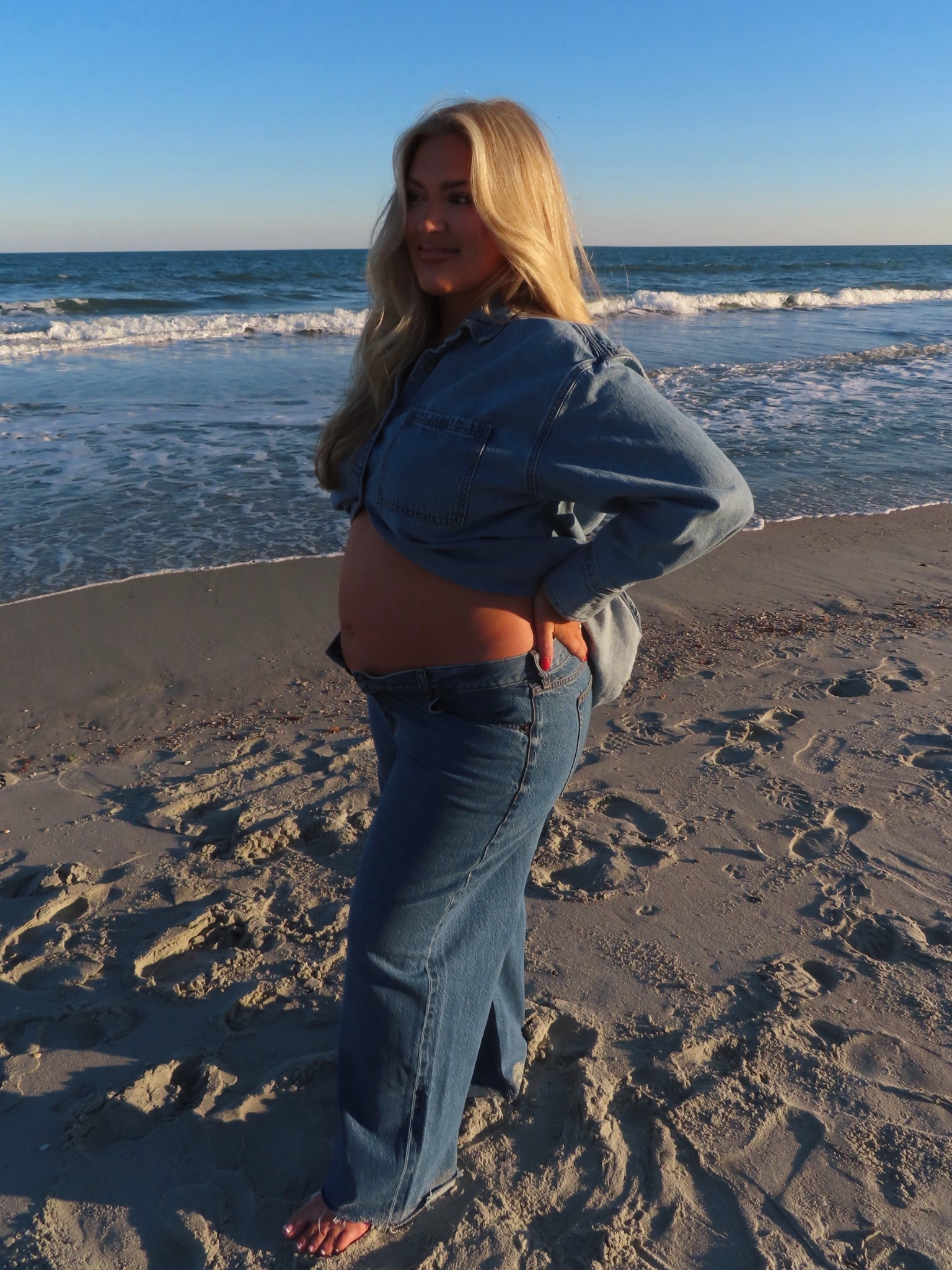 Best jeans to wear when pregnant! Mine button (sized up 2) but left undone for the pics lol

#LTKBump #LTKootd #LTKBaby