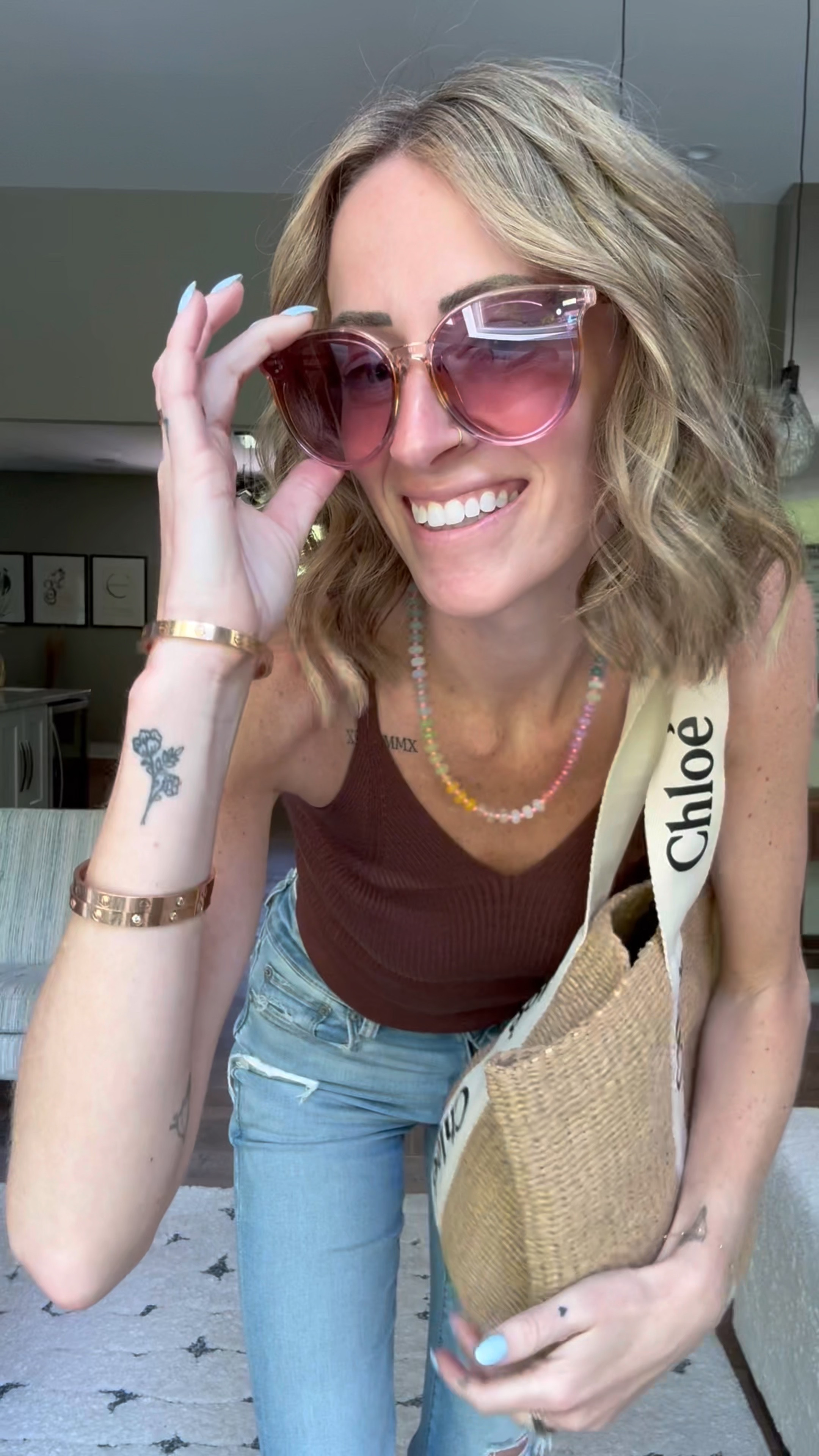 Easy spring and summer outfit 
Amazon brown knit tank top and sunglasses