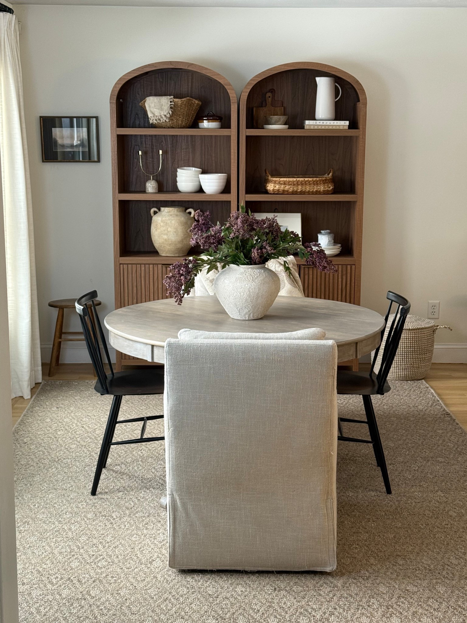 New cabinets for our kitchen eat in area! Love how they bring in that much needed warmth with a pretty brown tone, color and storage underneath. And I love the arched insulated detail.

Link to Modern Bookcase:
Color: Brown
https://bit.ly/4qP871X 
use code PS20 for 20% off!

#LTKSeasonal #LTKHome