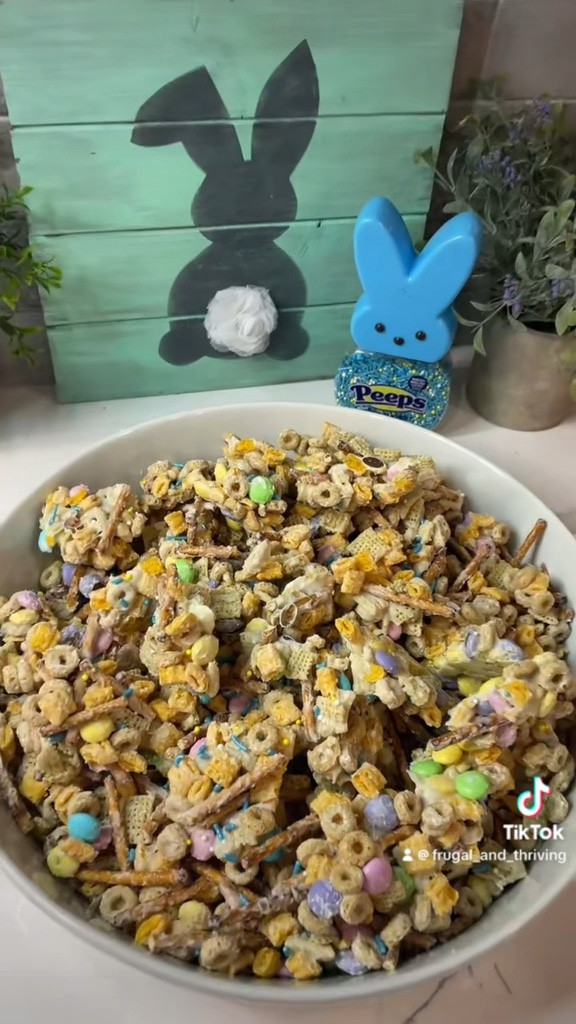 DIY Bunny Bait 🐰 

2 cups pretzels 
2 cups Cap’N Crunch
2 cups Toasted O’s
2 cups Rice Chex
2 cups/10oz bag of Pastel M&M’s

Mix

2 cups/whole 10oz bag of white chocolate chips (sub almond bark if desired), melt in 30 sec intervals in microwave until melted 

Mix into pretzels/cereal/M&M’s

Spread onto parchment lined sheet pan

Sprinkle with Peeps sprinkles 

Place into fridge or freezer for up to 15 mins to harden

Break up into pieces and place into container/bowl

Enjoy! 🐰

#easter #eastertreats #bunnybait
#fandt #frugalandthriving #eastersnack #dessert #bunny #easysnack #FoodTok #Recipe #Itk #fyp 

#LTKparties #LTKVideo #LTKSeasonal