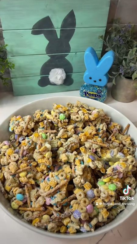 DIY Bunny Bait 🐰 

2 cups pretzels 
2 cups Cap’N Crunch
2 cups Toasted O’s
2 cups Rice Chex
2 cups/10oz bag of Pastel M&M’s

Mix

2 cups/whole 10oz bag of white chocolate chips (sub almond bark if desired), melt in 30 sec intervals in microwave until melted 

Mix into pretzels/cereal/M&M’s

Spread onto parchment lined sheet pan

Sprinkle with Peeps sprinkles 

Place into fridge or freezer for up to 15 mins to harden

Break up into pieces and place into container/bowl

Enjoy! 🐰

#easter #eastertreats #bunnybait
#fandt #frugalandthriving #eastersnack #dessert #bunny #easysnack #FoodTok #Recipe #Itk #fyp 

#LTKparties #LTKVideo #LTKSeasonal