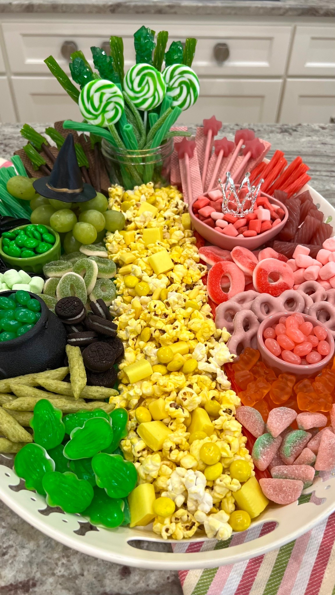 This Wicked(ly) magical Movie Snack Board has everything you could want to get ready for the Wicked: For Good premiere! 💚🩷💛 With dueling pink and green snack sides, a towering green emerald city and a buttery yellow brick road, there's no shortage of fun to this board. 🤗

#LTKParties #LTKFamily