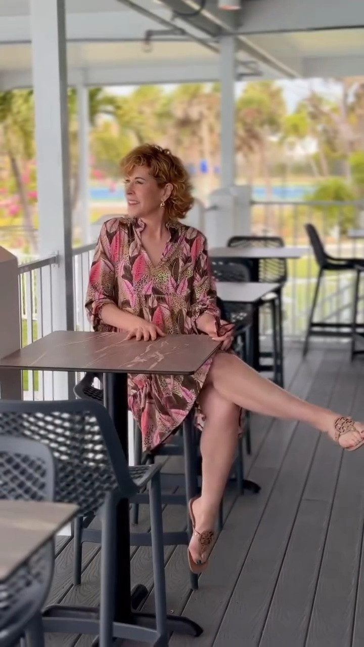 This is the kind of dress that makes you want to book a sunshine getaway.
☀️

The palm print with soft pink and green accents feels tropical but grounded, and the silhouette is easy, flowy, and flattering without trying too hard. I love the ruffle collar, v-neckline, bracelet-length sleeves, and the fact that it’s made with UPF 50+ fabric for built-in sun protection. And yes, it has pockets, which always feels like a small gift.
🙌🏻
This is one of those dresses that works for vacation days and real life alike. Comfortable, pretty, and full of sunshine energy.
Use code SUZY15 for 15% off!


#LTKTravel #LTKActive #LTKSeasonal