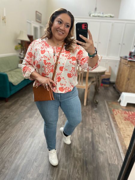 Easy spring outfit. Flowing top with lighter washed denim jeans these leather white sneakers go with everything. Finish off this outfit with a cognac Crossbody bag.

#LTKmidsize #LTKover40 #LTKSeasonal