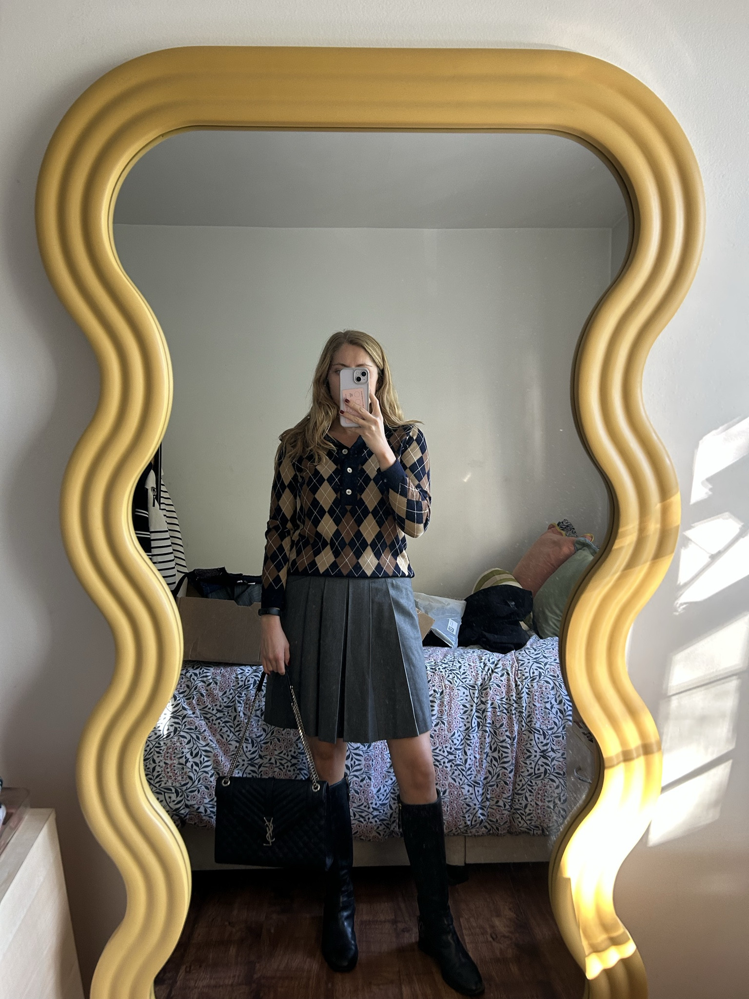  

 Argyle jumper, golf jumper, grey pleat skirt, workwear, black knee boots

#LTKwinter #LTKautumn #LTKuk