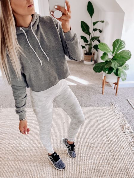 These white canoe leggings from Amazon are so perfect for the gym. The fabric is a silky performance fabric with tons of stretch. The leggings have pockets and fit true to size. I’m wearing size small here. My sneakers are kids sizes and I will like a few other shoe options. 

#LTKunder50 #LTKFitness #LTKunder100