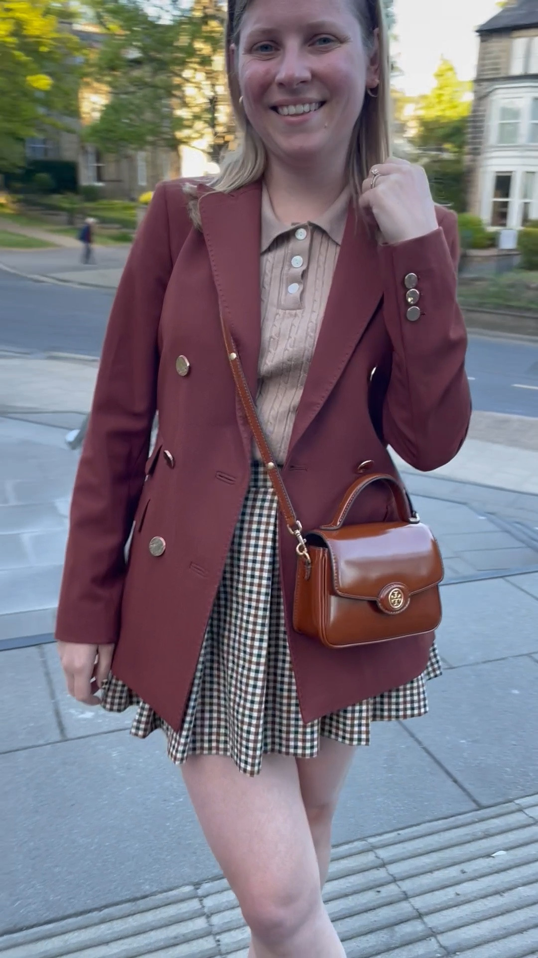 A classic monochrome look for a night out in England. A plaid pleated mini skirt with a cable knit polo and a chic blazer to pull the look together.