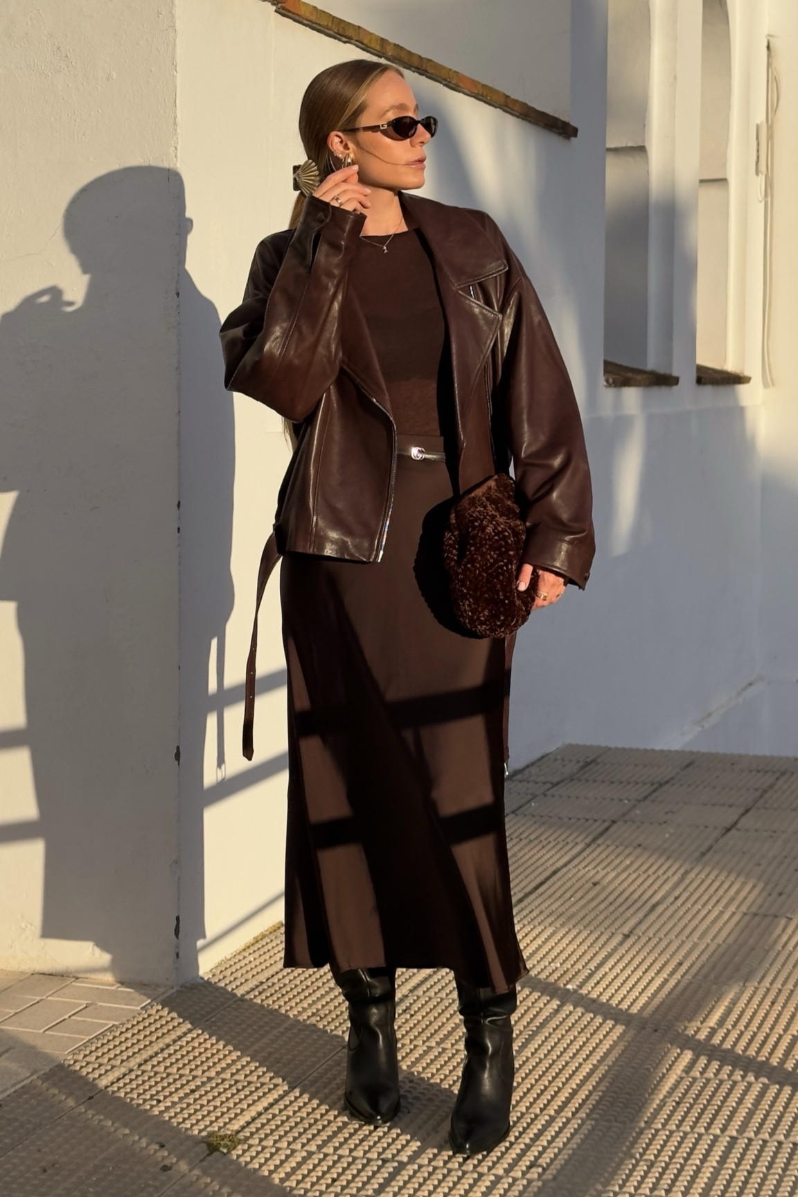 Brown attire — wearing a chocolate brown leather jacket, silk skirt, a longsleeve top and high knee boots — combined my brown Gucci sunnies and a shell hair clip 🤎

#LTKeurope #LTKstyletip #LTKdeutschland