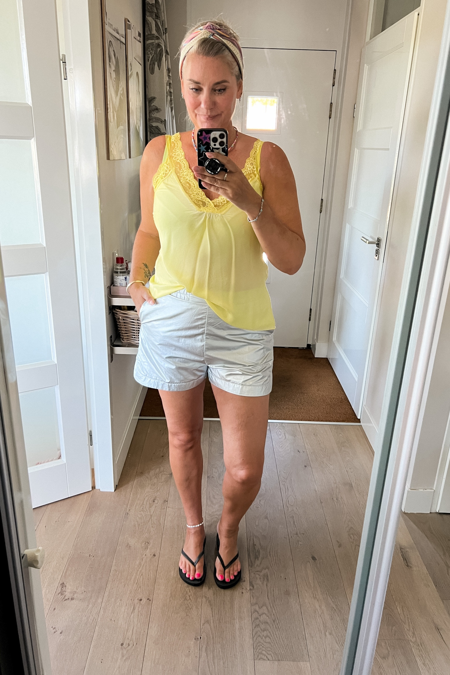 Ootd - Monday. Yellow lace trim camisole paired with silver shorts (Shoeby sale), shell ankle bracelet, black flipflops, headband from Luvvies by Saar. 



#LTKeurope #LTKnederlands #LTKsummer