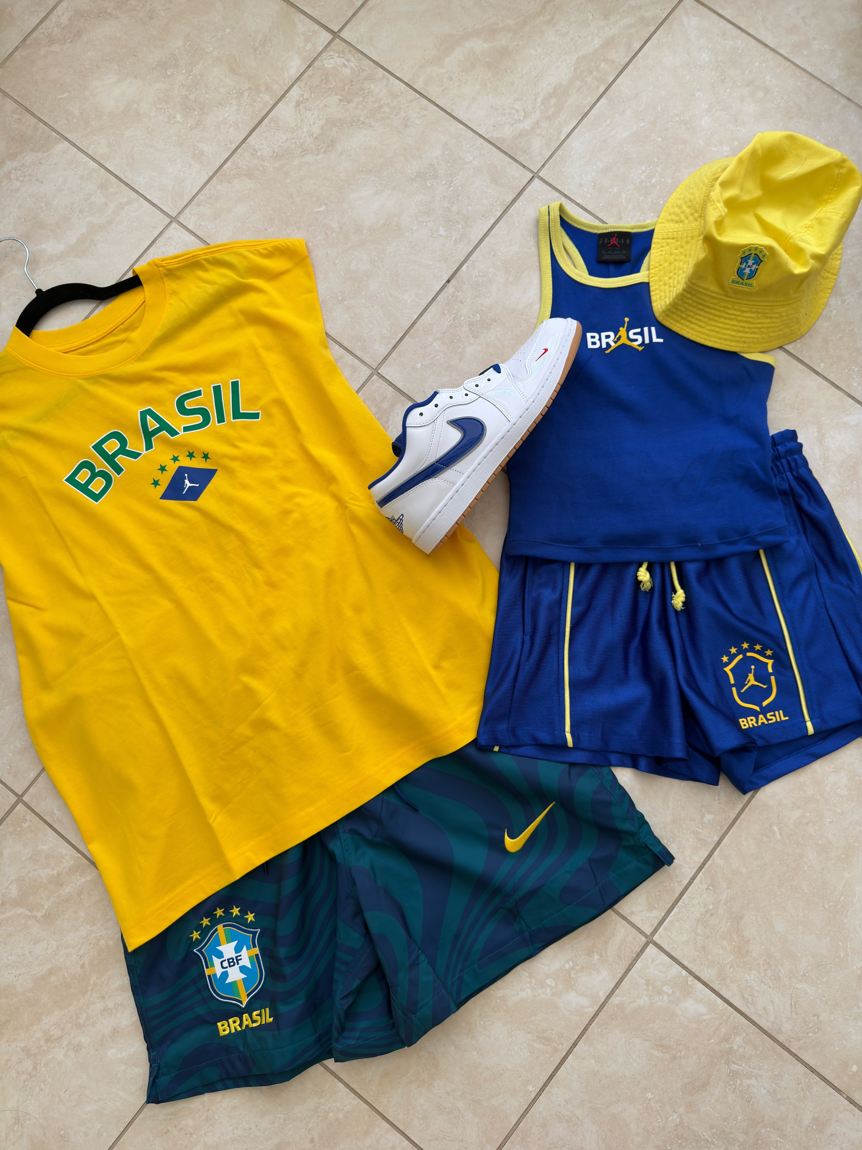 This one is personal.
I'm Brazilian. So when the World Cup comes around, it's not just a sporting event in our house — it's a whole thing. And this year we're showing up properly.
His: the yellow Brasil Jordan tee with the CBF shorts. Hers: the blue Jordan Brasil tank set with the bucket hat that I am not taking off. Both outfits anchored by the white and blue Air Jordan 1s because apparently we match now and I'm okay with it.
Nike x Jordan Brand x Brasil is a collab that hits different when this is actually your country. The colors, the crest, the five stars — it means something.
Everything is linked. Shop fast — Brasil gear in World Cup years does not sit on shelves.
Vai Brasil. 🇧🇷 

 #LTKover40 #LTKmom #LTKstyletip #WorldCup2026 #BrasilWorldCup #NikeBrasil #JordanBrand #WorldCupOutfit #HisAndHers #VaiBrasil
