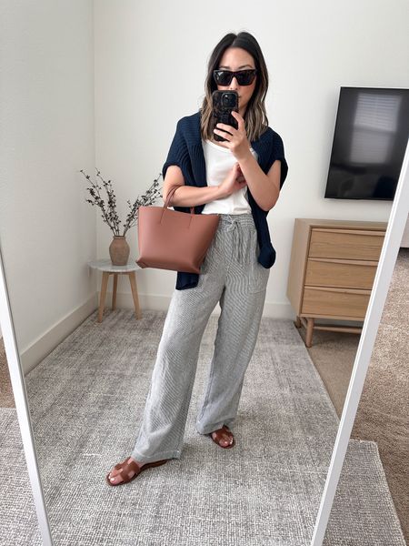 Gap Factory petite linen pants. These are GREAT! Lightweight, comfy, and a great length. Not sure if there’s any petites sizes left so I linked the ones from Reformation. 

Reformation tank xs
Gap Factory linen pants petite xs
Hermes Oran sandals 35
Everlane bag
Jenni Kayne cardigan xxs (old) 
Celine sunglasses 