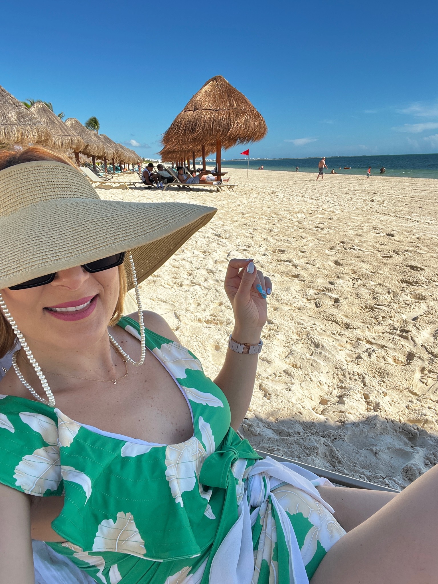 Sunnies, faux pearl chain and straw hat linked. 

Swimsuit: https://bit.ly/3TLFvYa

#LTKswim