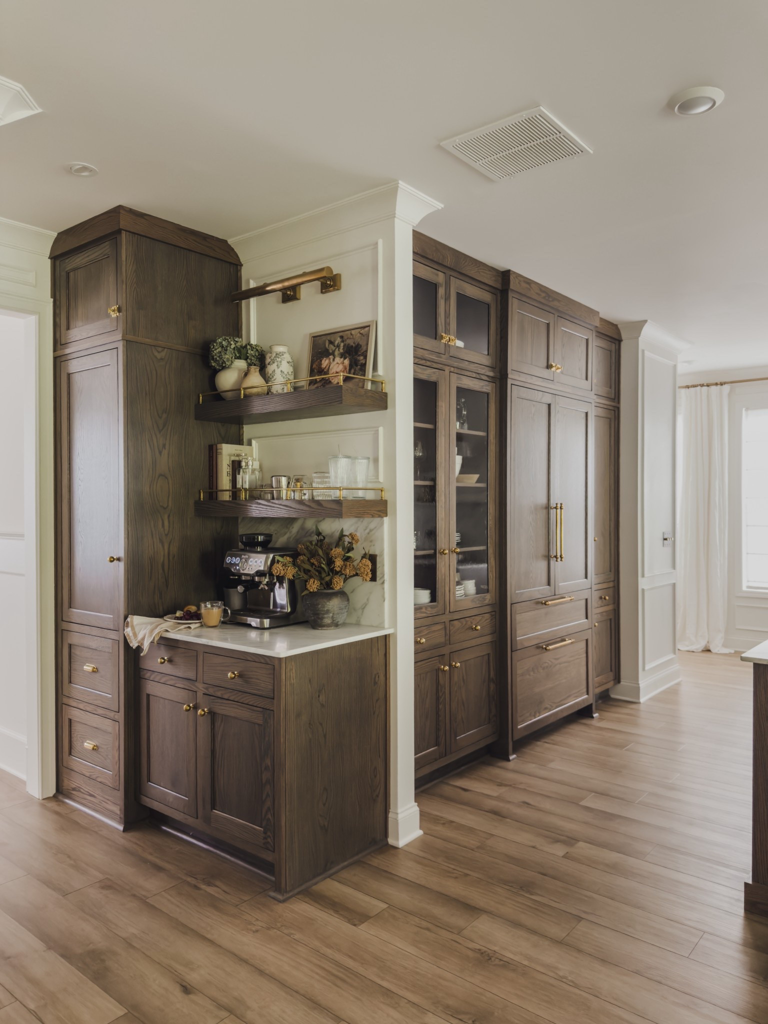 Fall coffee bar views! Loving this space so much and adding pops of seasonal florals to create a cohesive look throughout the main floor of my home. 

Home finds, coffee bar details, open shelving, brass detail, fall refresh, picture light, faux florals, espresso machine, rich wood tones, marble countertop, coffee bar inspo, neutral home inspo, Rejuvenation, Breville, Etsy, Pottery Barn style, shop the look!
#LTKStyleTip

#LTKSeasonal #LTKHome