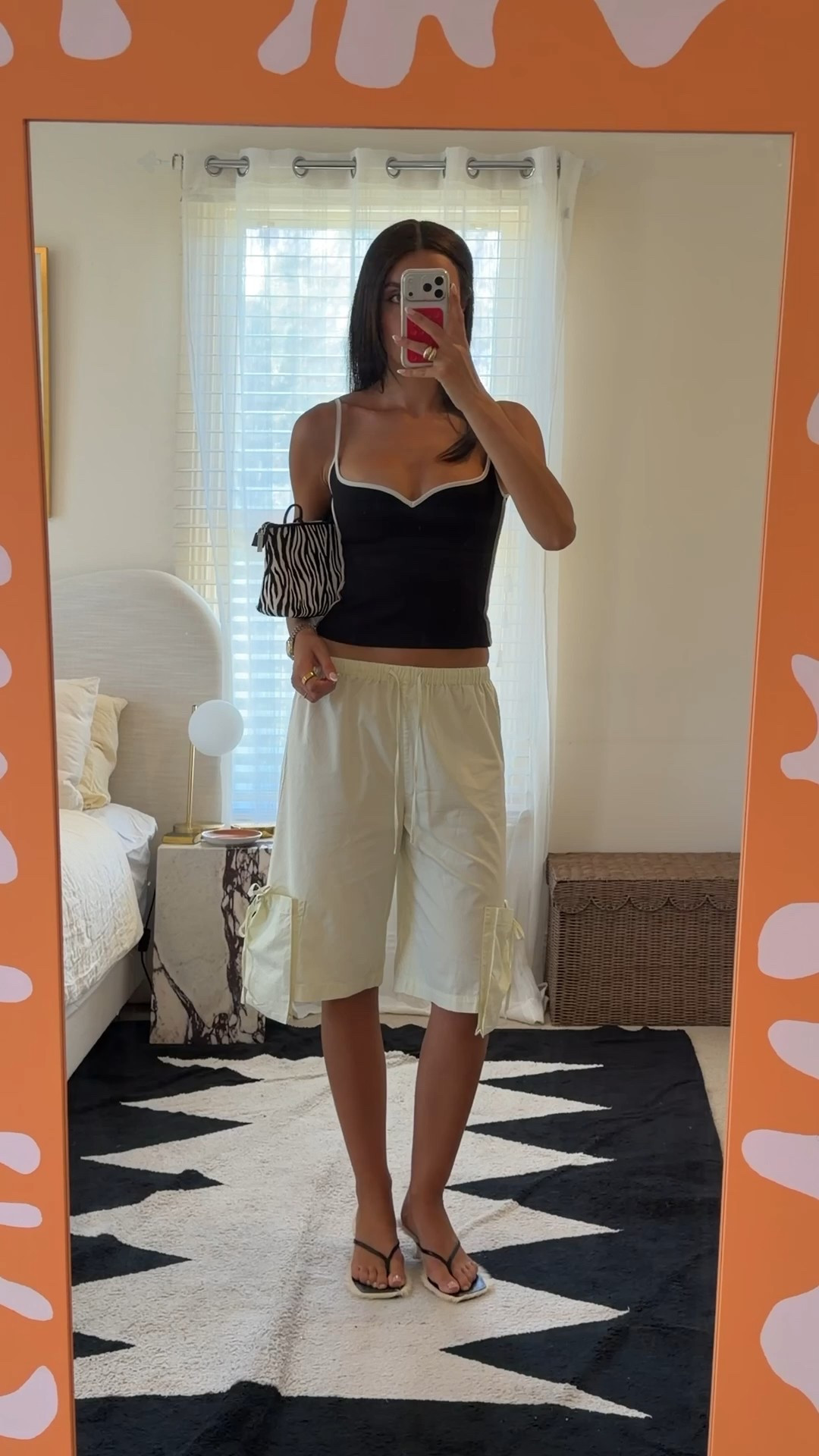 Today’s OOTD. I’ve had this Paris Georgia singlet for years and I still love and wear it so much. It’s the perfect form fitting structure that is so flattering. Paired perfectly with these pony hair sandals which are so chic and comfortable and match this zebra bag so well! #pinyhairsandals #blacksinglet 

#LTKaustralia