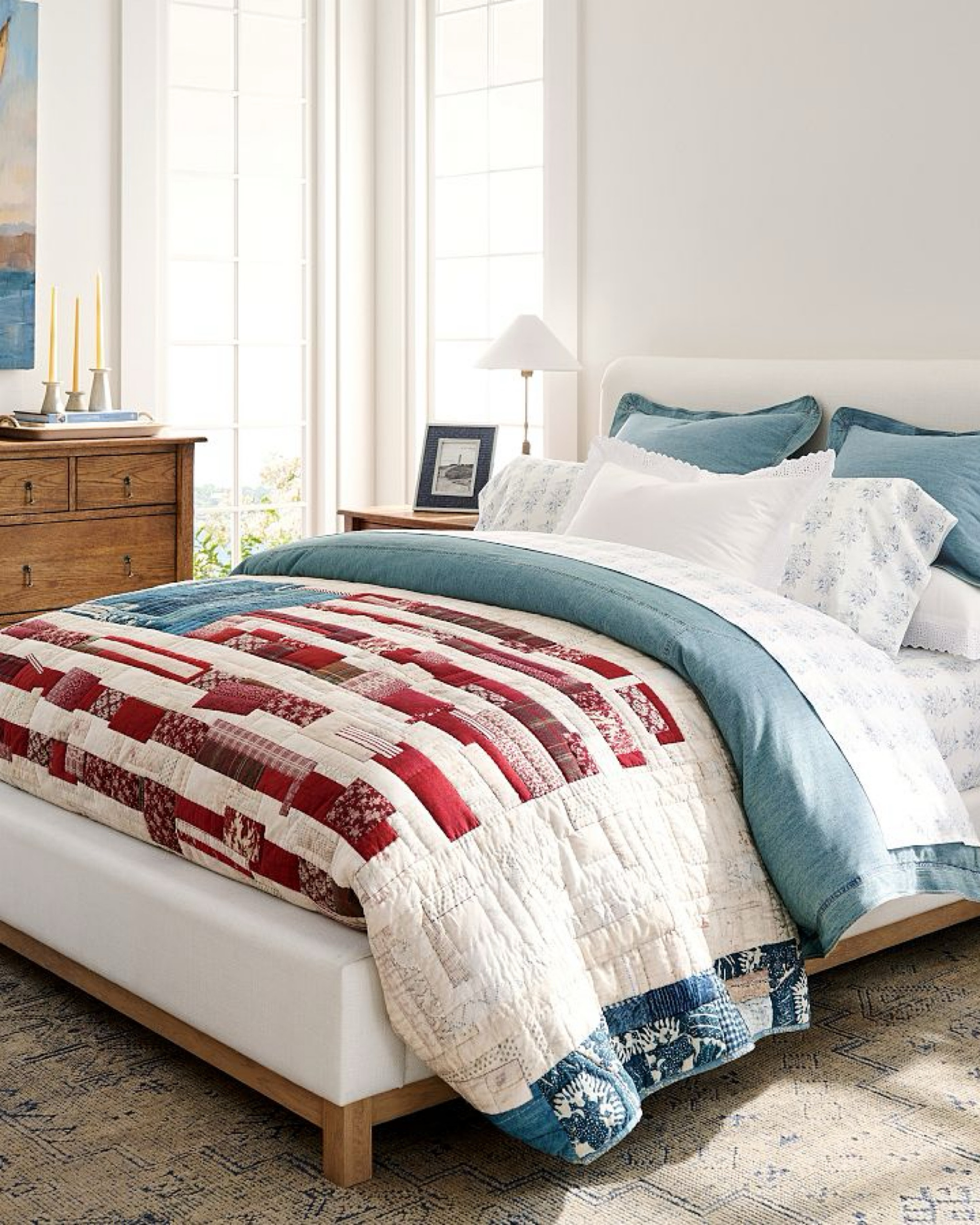 This gorgeous American flag quilt is hand stitched and crafted with care. It features a heritage patchwork of faded shades of red and blue. This is a beautiful family heirloom in the making, each quilt is labeled with a message commemorating a unique story and the year in which it was made. A patriotic piece of art to pass down for many generations.
