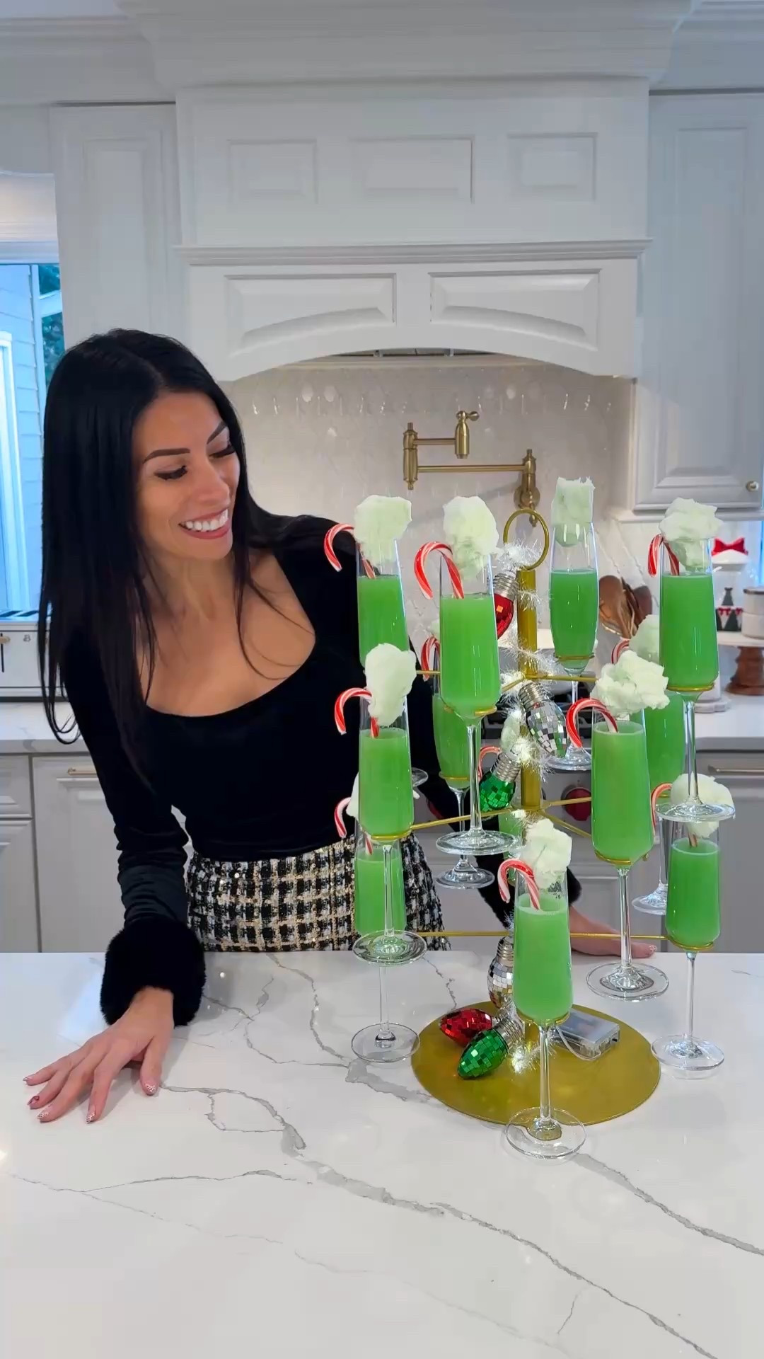 GRINCH MIMOSAS for the win! This is what I used 🙌🏻
* 3 oz orange juice 
* 1/2 oz blue curacao 
* 4 oz prosecco or another sparkling wine 
* 1 candy cane
* green cotton candy
To a glass, add the juice and blue curaçao and watch it turn green, top with prosecco and garnish with candy cane and cotton candy in top. 


#LTKHoliday #LTKfoodie #LTKHome