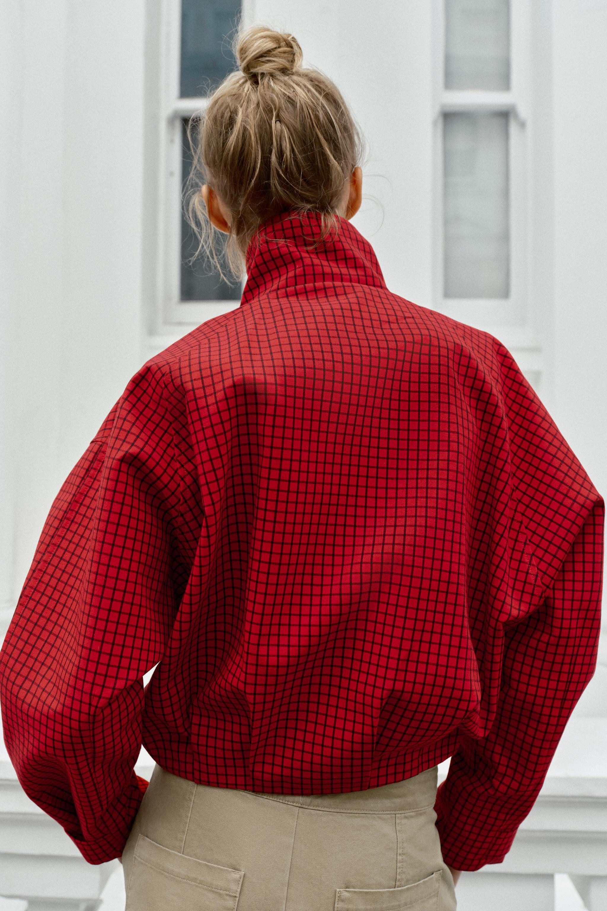 Bomber-style jacket with a high collar and long sleeves. Featuring adjustable cuffs with a press-... | Zara UK